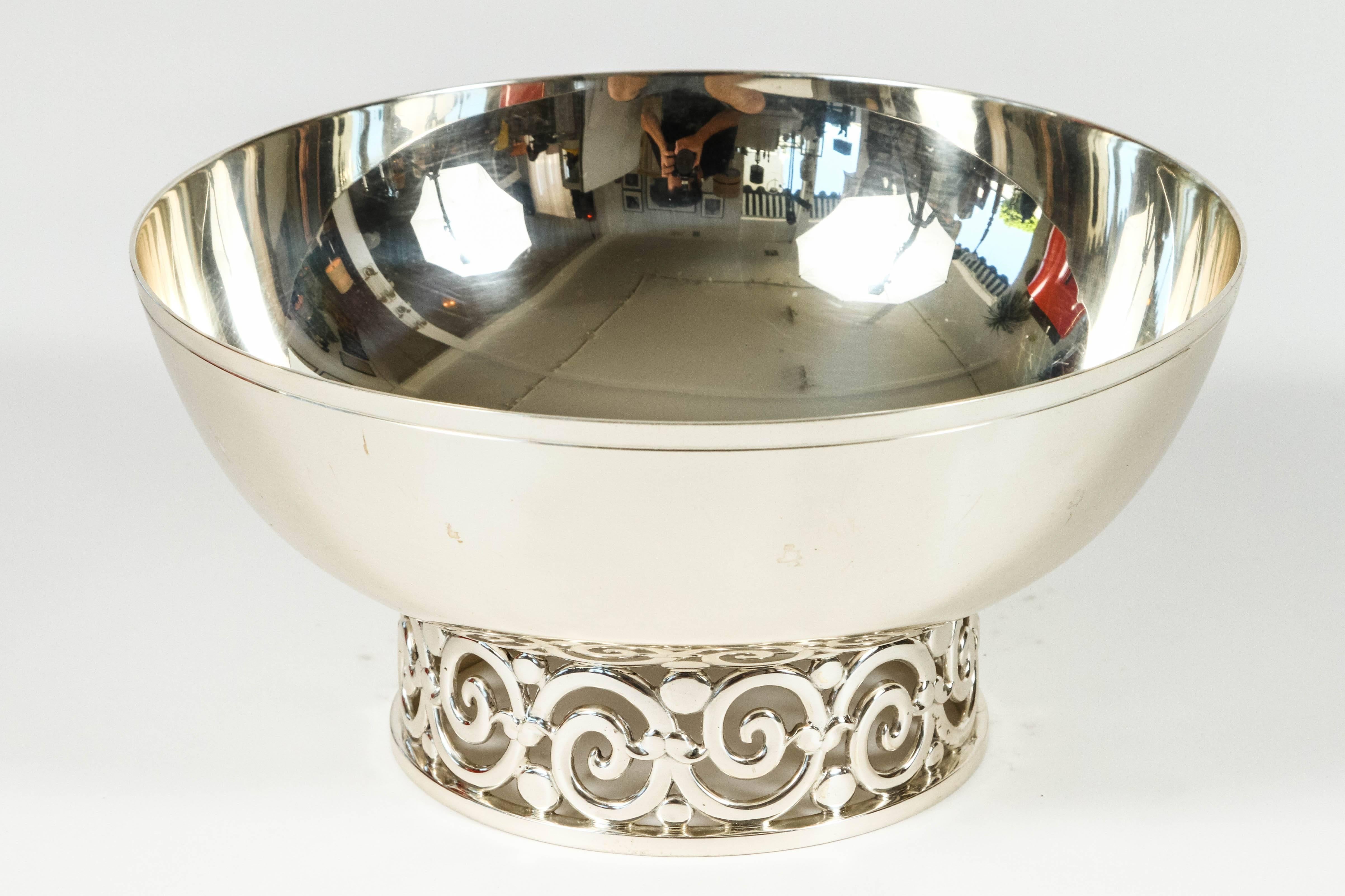 Elegant serving bowl by Tiffany & Co. is great for entertaining or as a decorative object on its own. The scrollwork base adds a nice focal point. The bowl is stamped on the underside: 