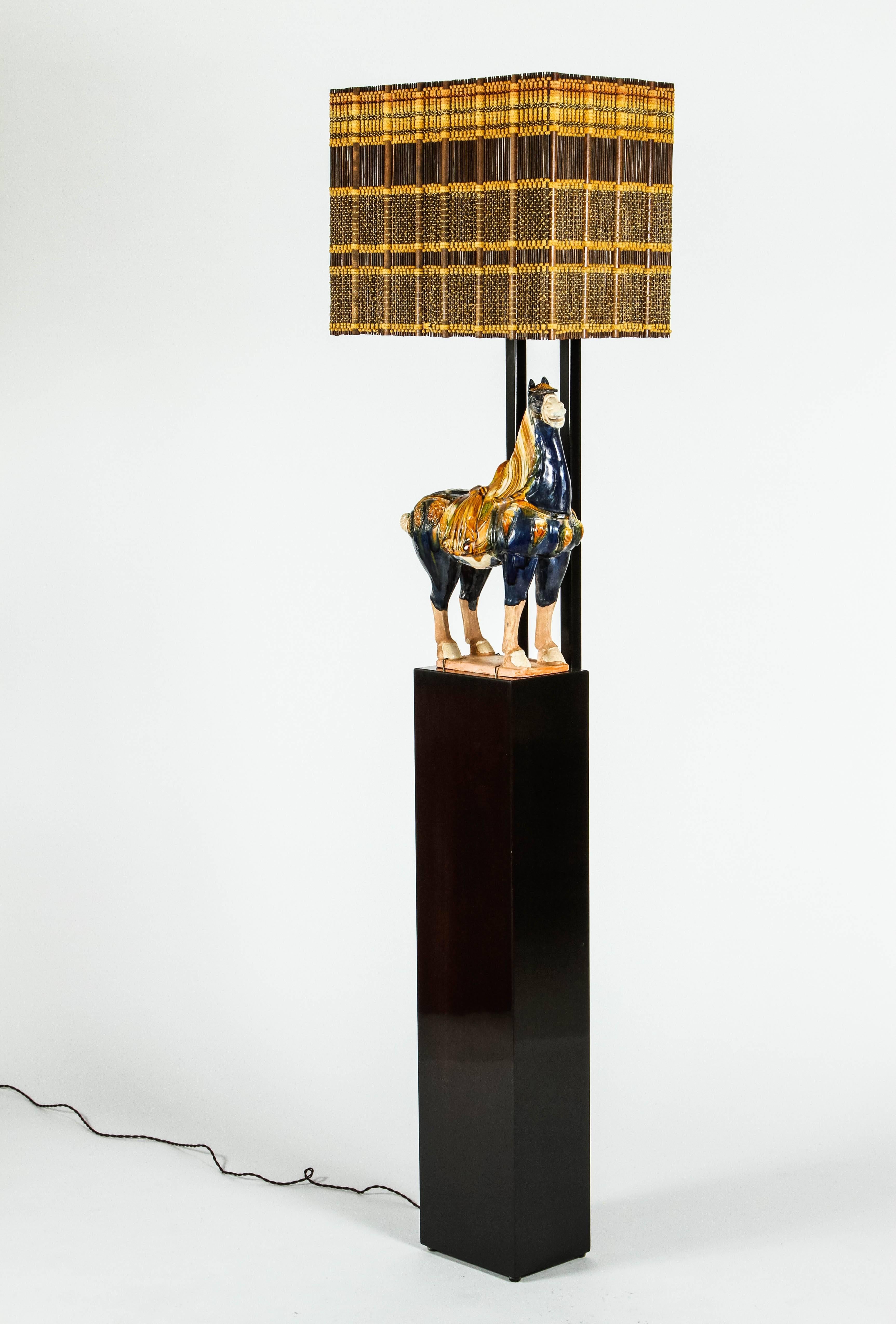 Wonderful armature floor lamp by William Haines featuring a Chinese horse and custom-made Maria Kipp shade. The lamp is a highly polished dark brown walnut with a black metal armature. The horse figure is not original to the lamp but quite often the