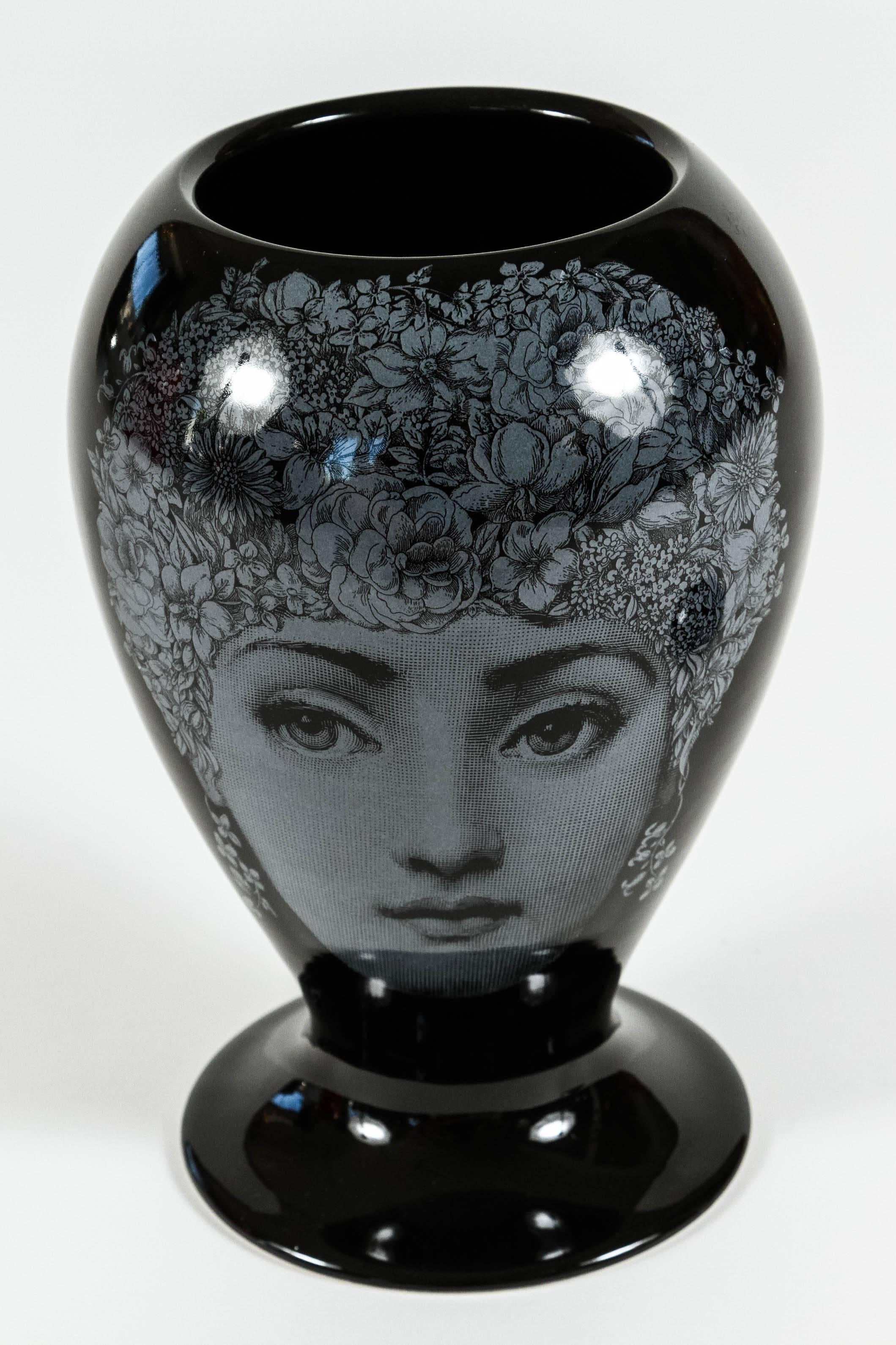Issued by Barnaba Fornasetti, Piero's son this black glazed limited edition vase with white double decors featuring 