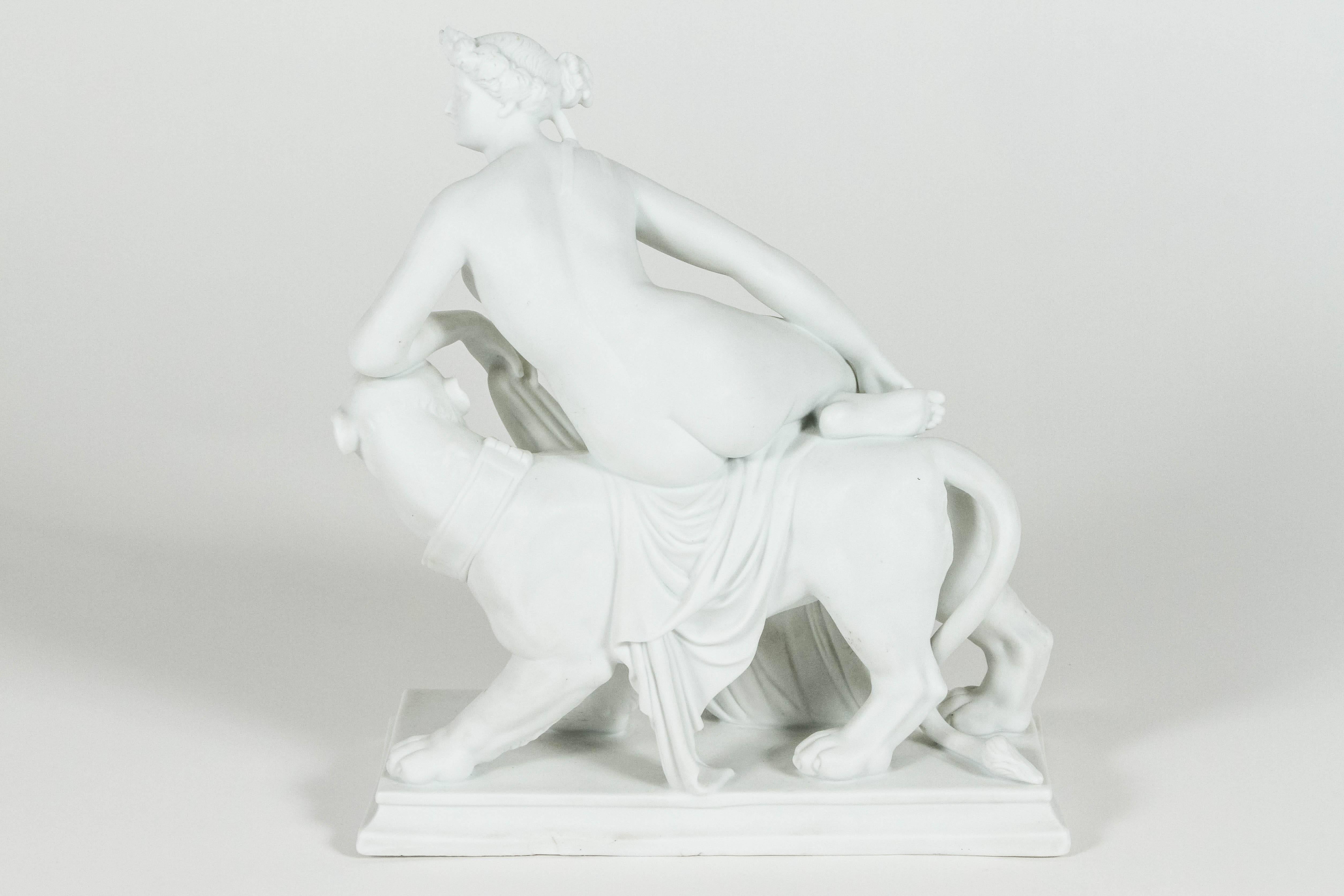 This lovely parian ware piece is in the style of a sculpture by Johann Heinrich von Dannecker and features the Classical Greek goddess Ariadne gracefully posed on the back of a panther. During the 19th century it was fashionable to have small