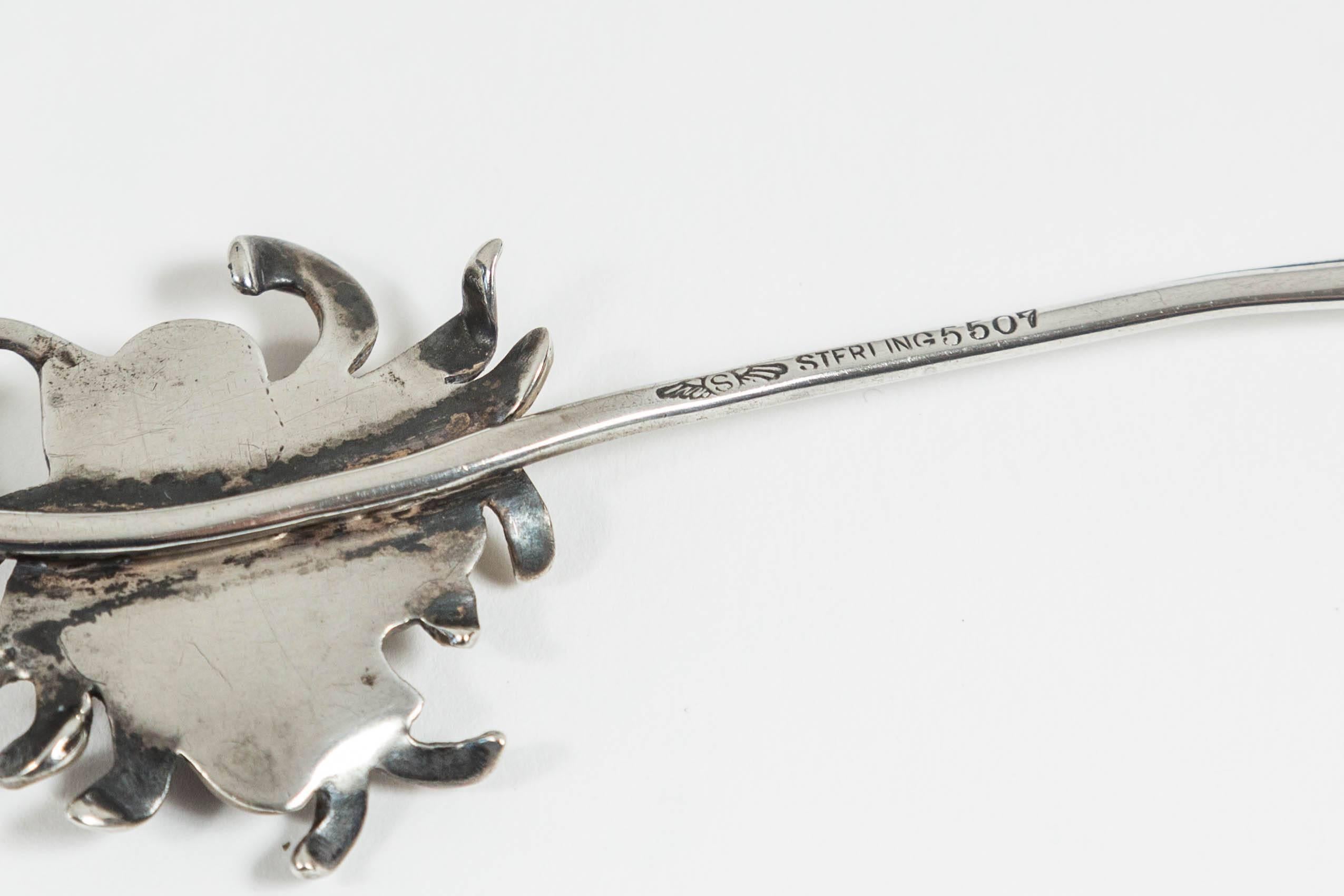 Unusual Art Nouveau chrysanthemum letter opener by American silver maker George W. Shiebler. Sterling silver. With leaf decorated blade and floral decorated handle. Very intricate workmanship. Bears Sheibler's winged s, and Sterling 5507 marks. 7