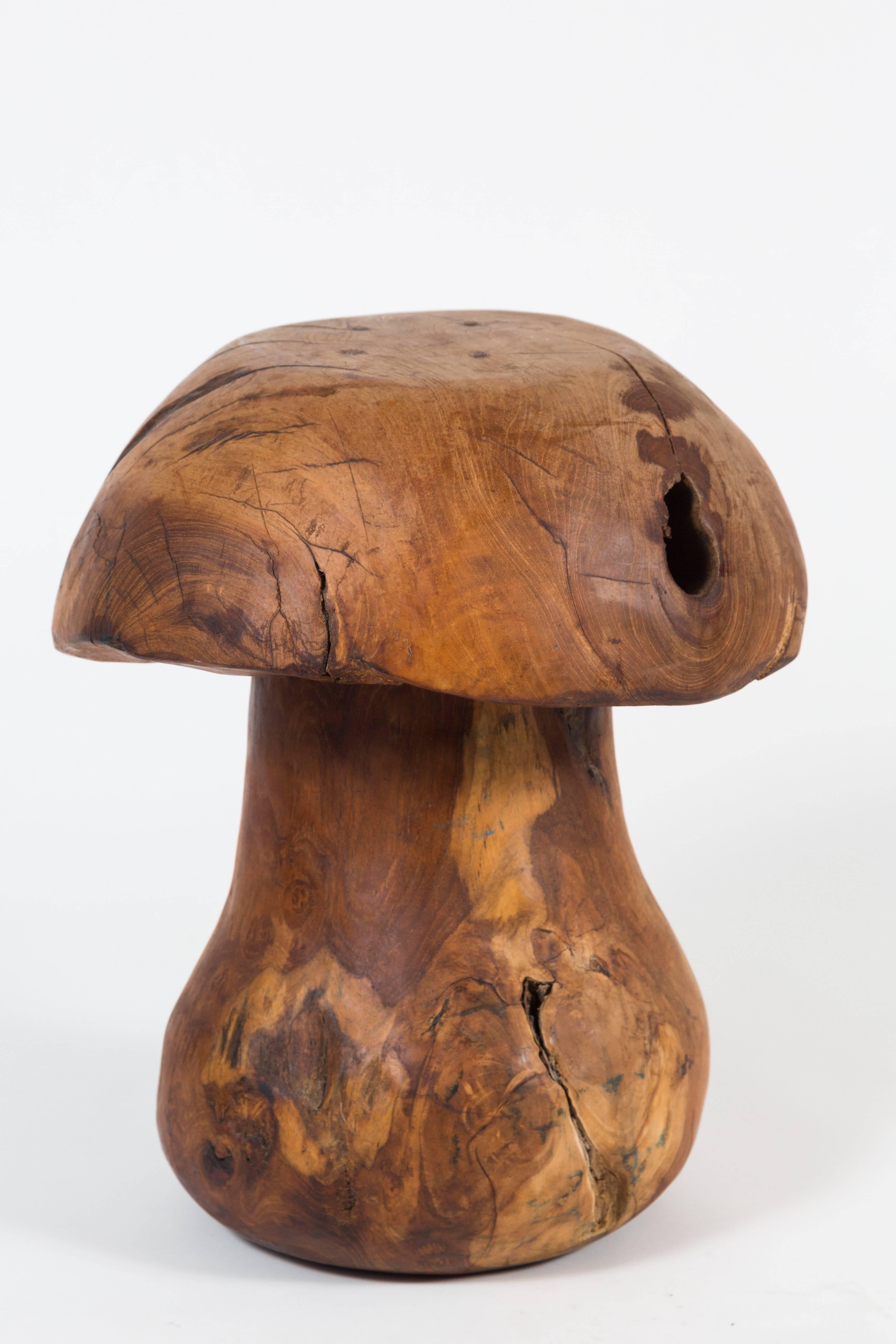 Fascinating group of mushroom-form rootwood stools. Each is constructed of two pieces, secured with wooden pegs. Each is unique, with wonderful striations and patina. Unsigned. These mushroom stools came from the Bay area and we have no further