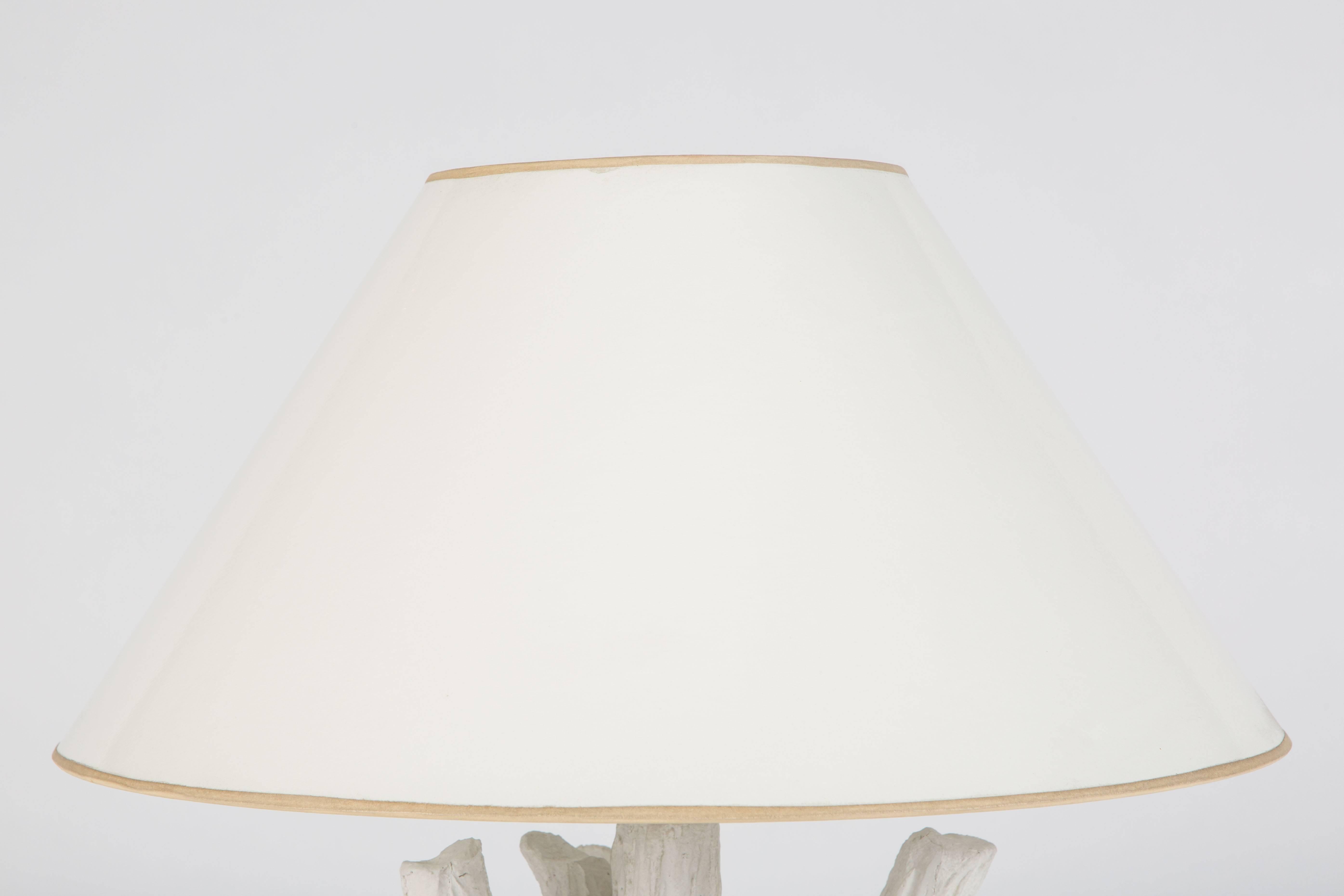 Rare table lamp from the late iconic San Francisco designer John Dickinson (1920-1982). Cast white Plaster of Paris, circa 1970s. 

Measures: 31 inches high; the base 10 1/2 inches wide; the shade 23 inches in diameter. All original condition,