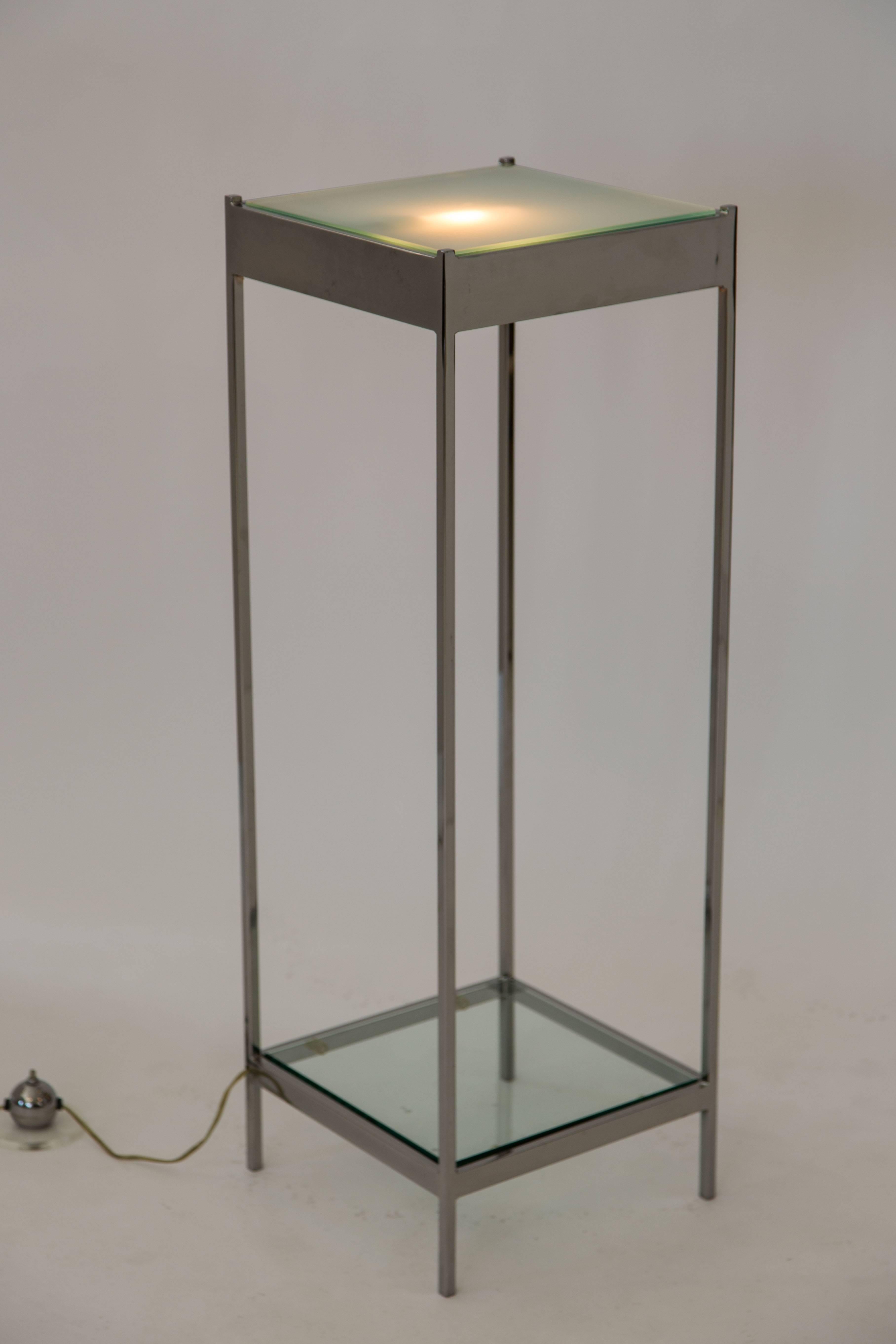 A wonderfully chic pair of chrome and glass pedestals. With frosted glass top inserts illuminated from beneath and clear glass bottom inserts. Perfect for displaying sculpture.

Newly restored with brand new glass inserts,

circa 1970s.