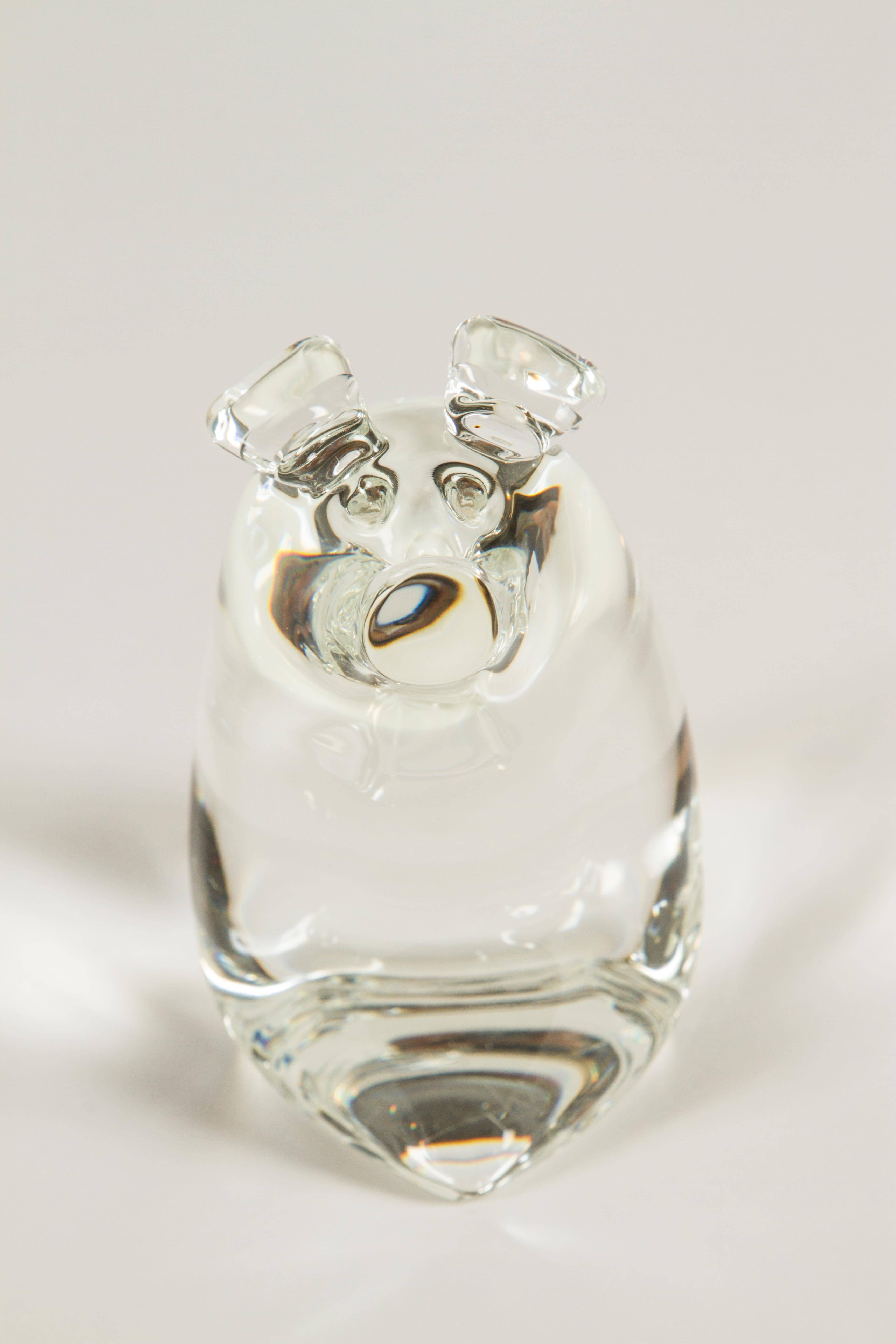 These adorable crystal pigs will bring a smile to your face! The two were designed and added to the Steuben menagerie in 1979.

Momma pig measures 5.5 H x 5.5 W x 3.75.

Baby pig measures 4.5 H x 4.5 W x 2.5
  
   
