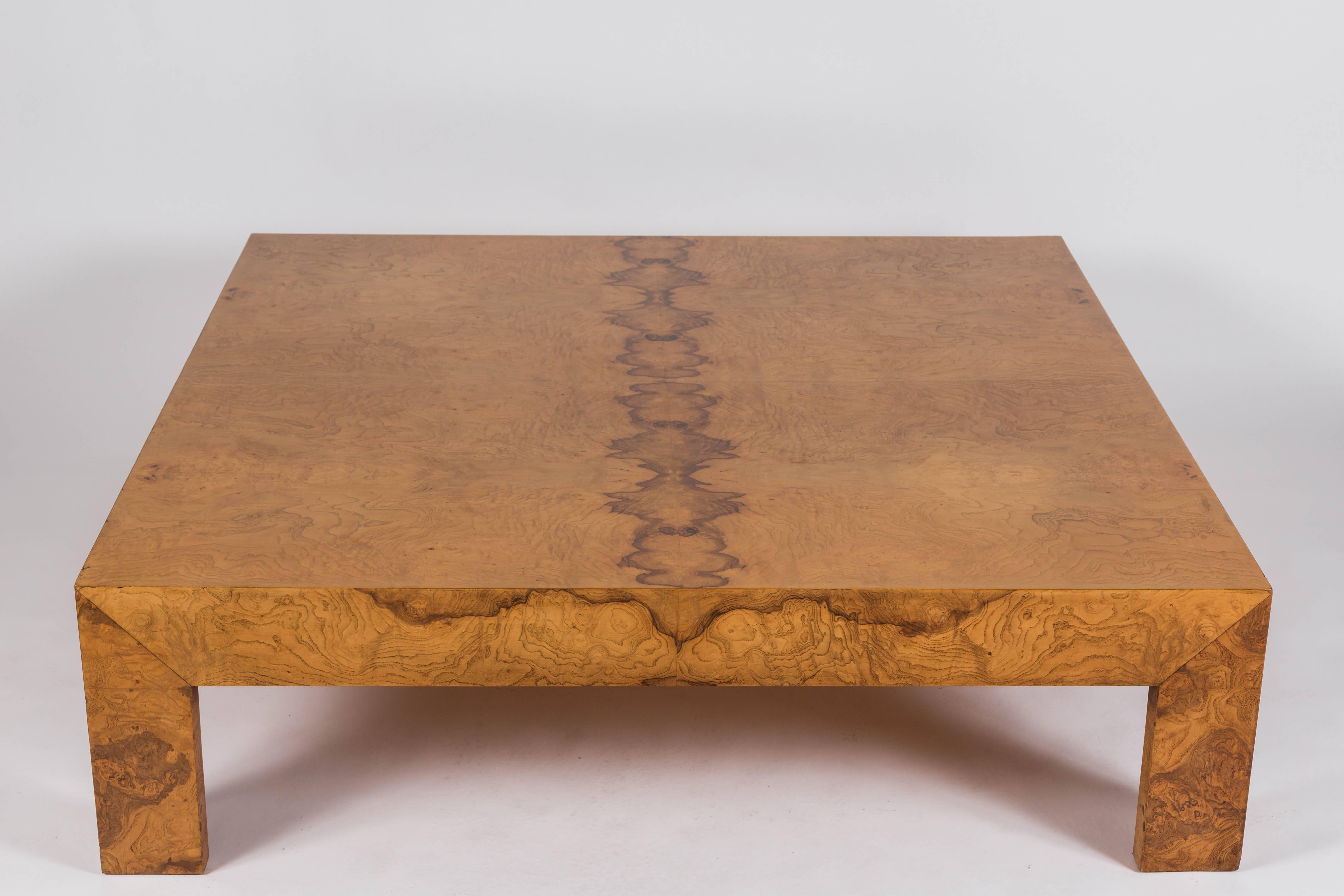 Beautiful low profile cocktail table constructed with book match burl wood veneers.