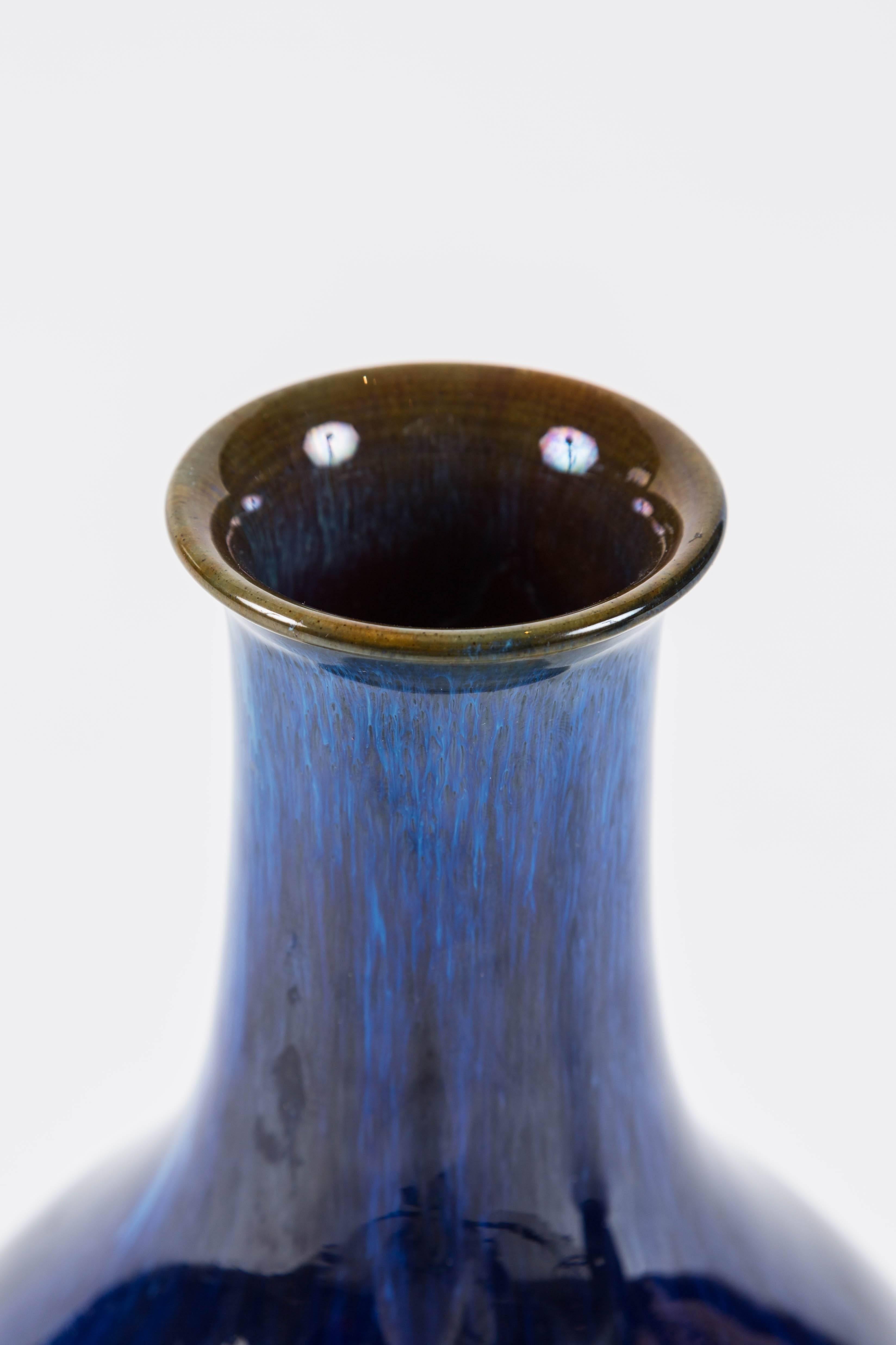 A beautiful matched pair of English stoneware vases with striking cobalt flambe glaze with a brown rim. These vases are real eye catchers and this glaze is very popular with collectors. The Danesby Ware Script mark appears in this work between