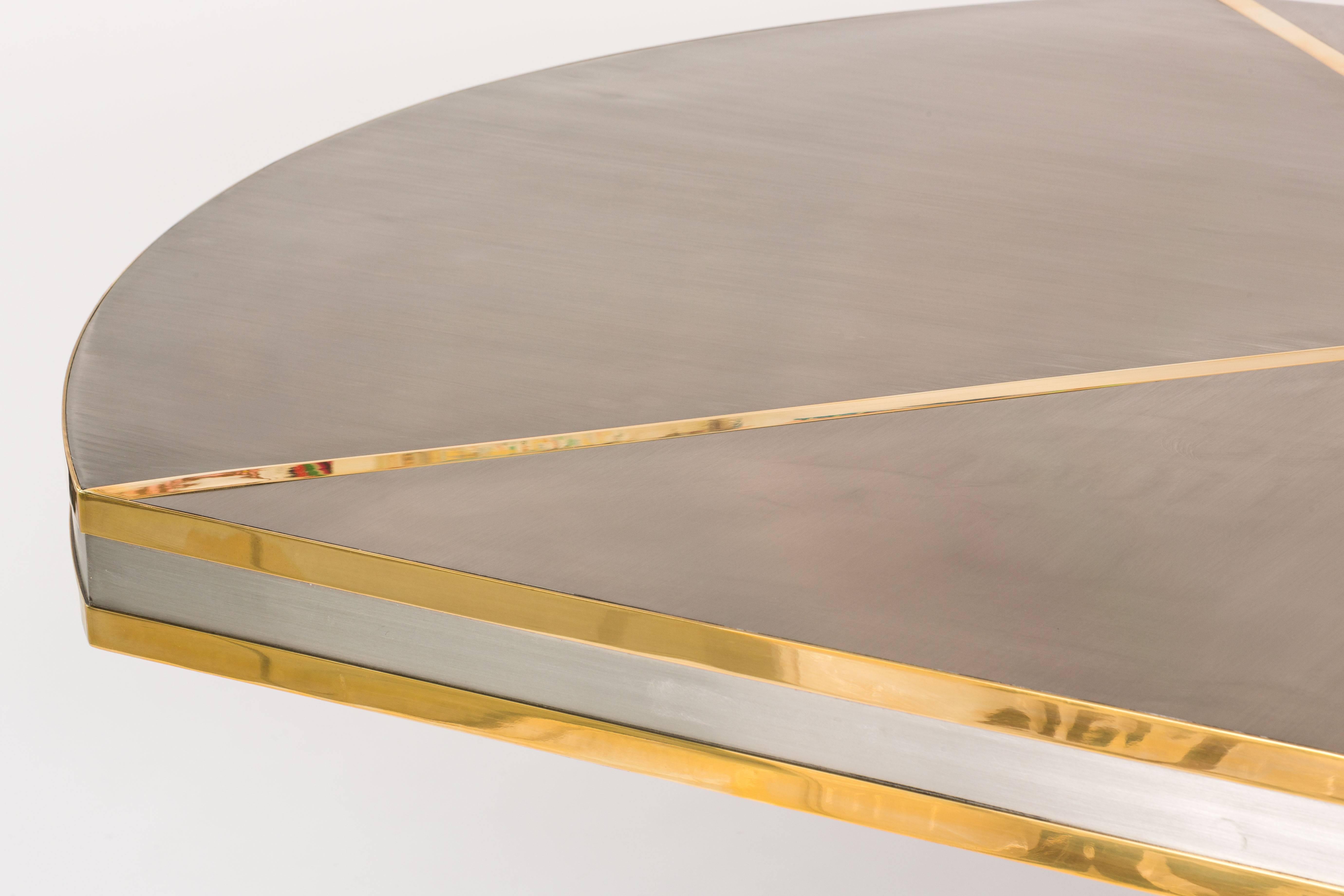 This dining table is guaranteed to provide memorable dining occasions for years to come. The brass on stainless is glamorous without being ostentatious. The stunning brass details highlight the tabletop with two bands while three (3) brass hoops
