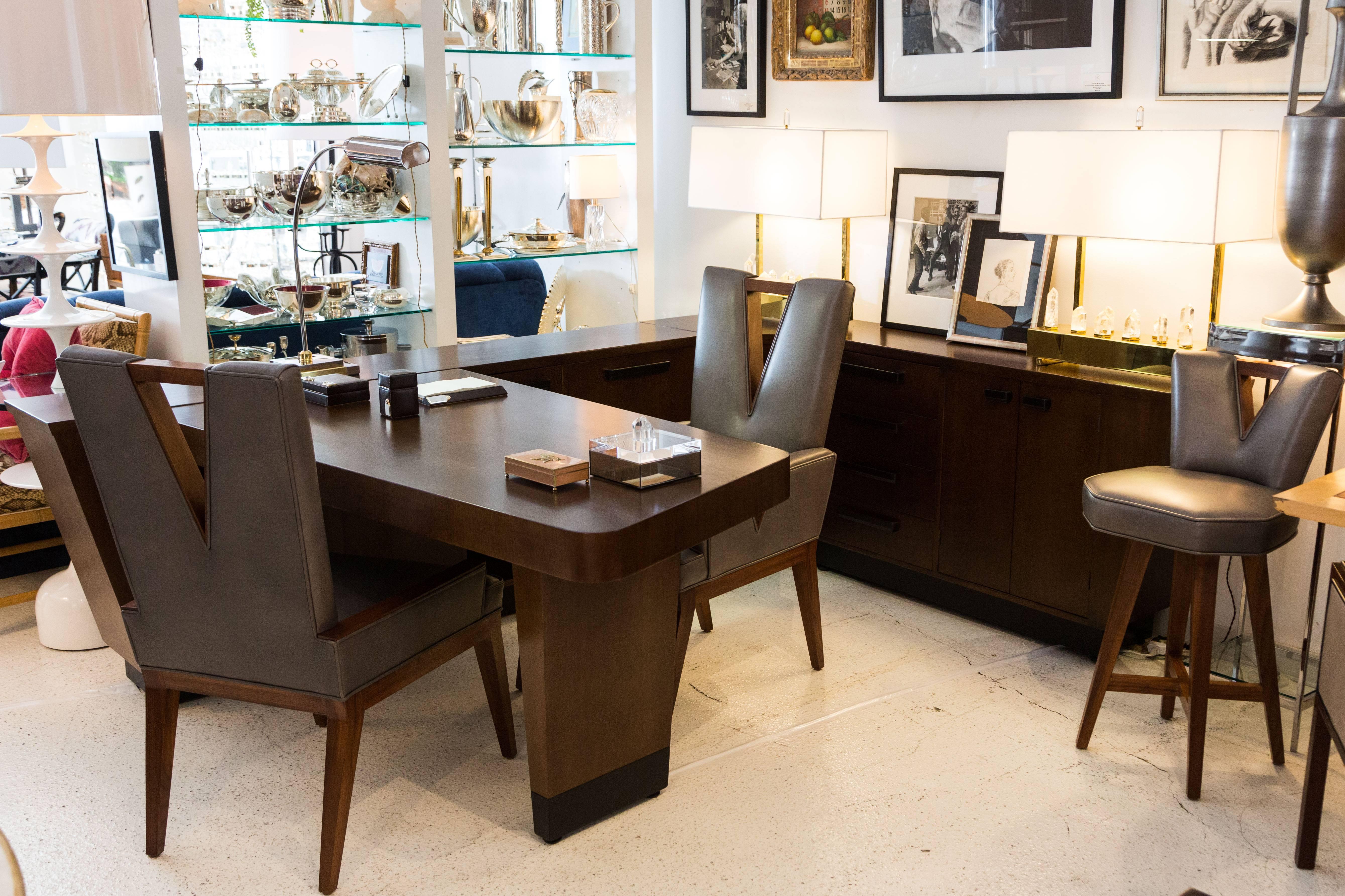 This is a unique opportunity to own a beautiful and unique desk with intergraded wrap around console. The desk et al has been completely restored to its former glory. The cabinet that surrounds the user is outfitted with both drawers and doors