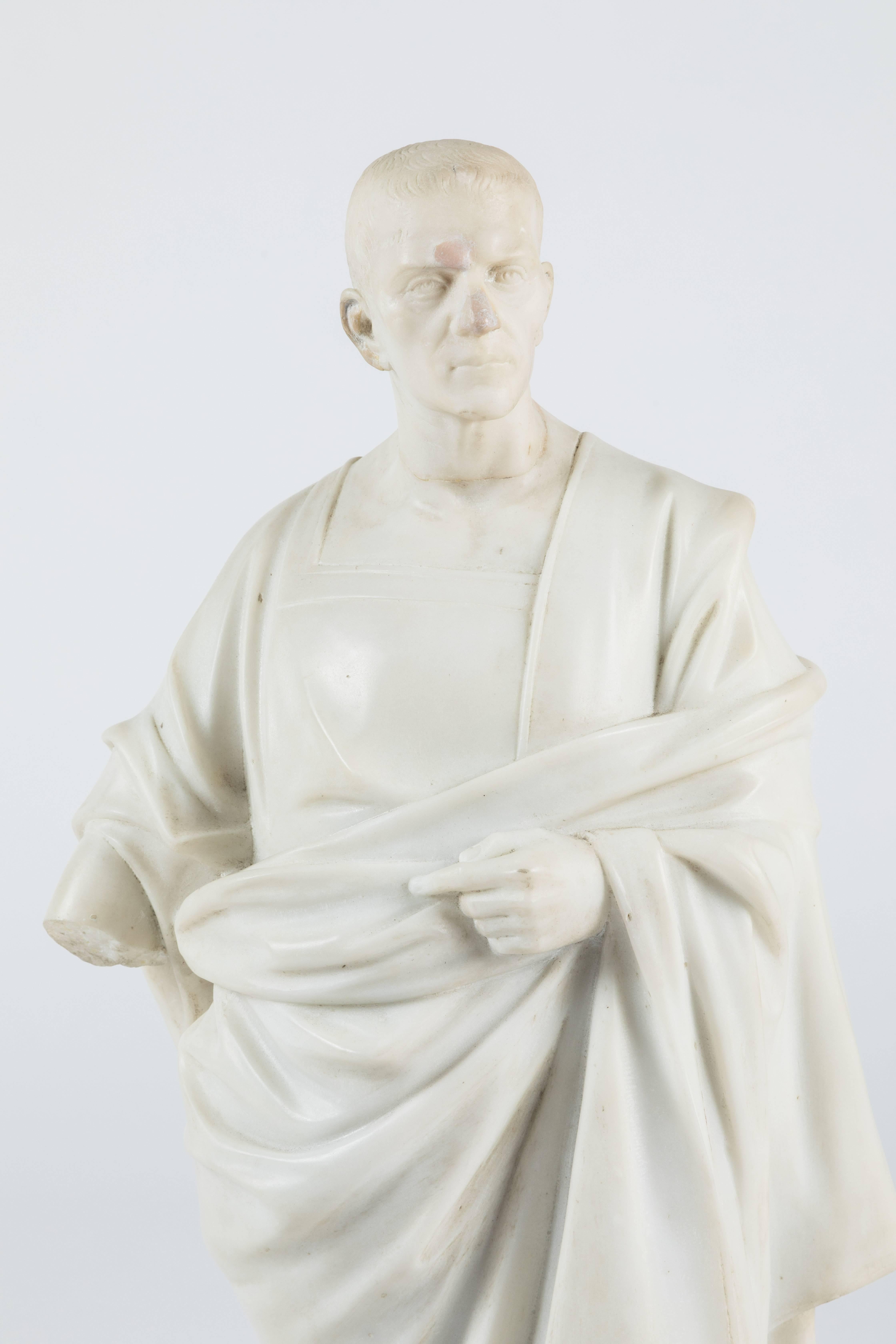 An intricately carved marble statue of a robed Roman official (possibly Marcus Tullius Cicero). This statue has extensive restorations so if you are looking for a perfect piece this one is not for you, but if you embrace a patina you are in luck.