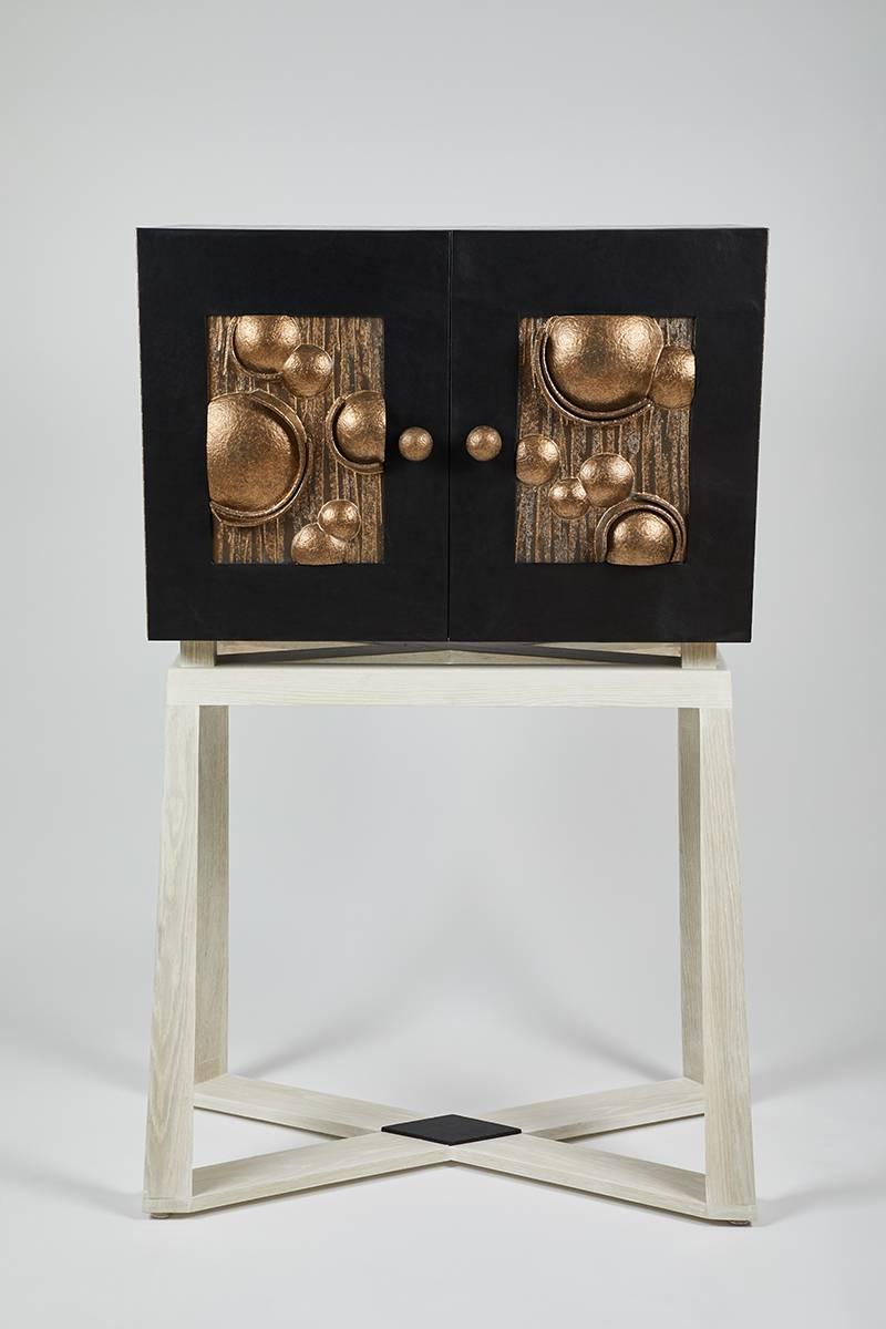 The Eclipse cabinet is a unique collaboration by Dragonette Private Label and LA Ceramicist Titia Estes. In their ongoing work together Patrick and Titia draw from each other. In the case of this cabinet Dragonette brought an idea to Estes, 