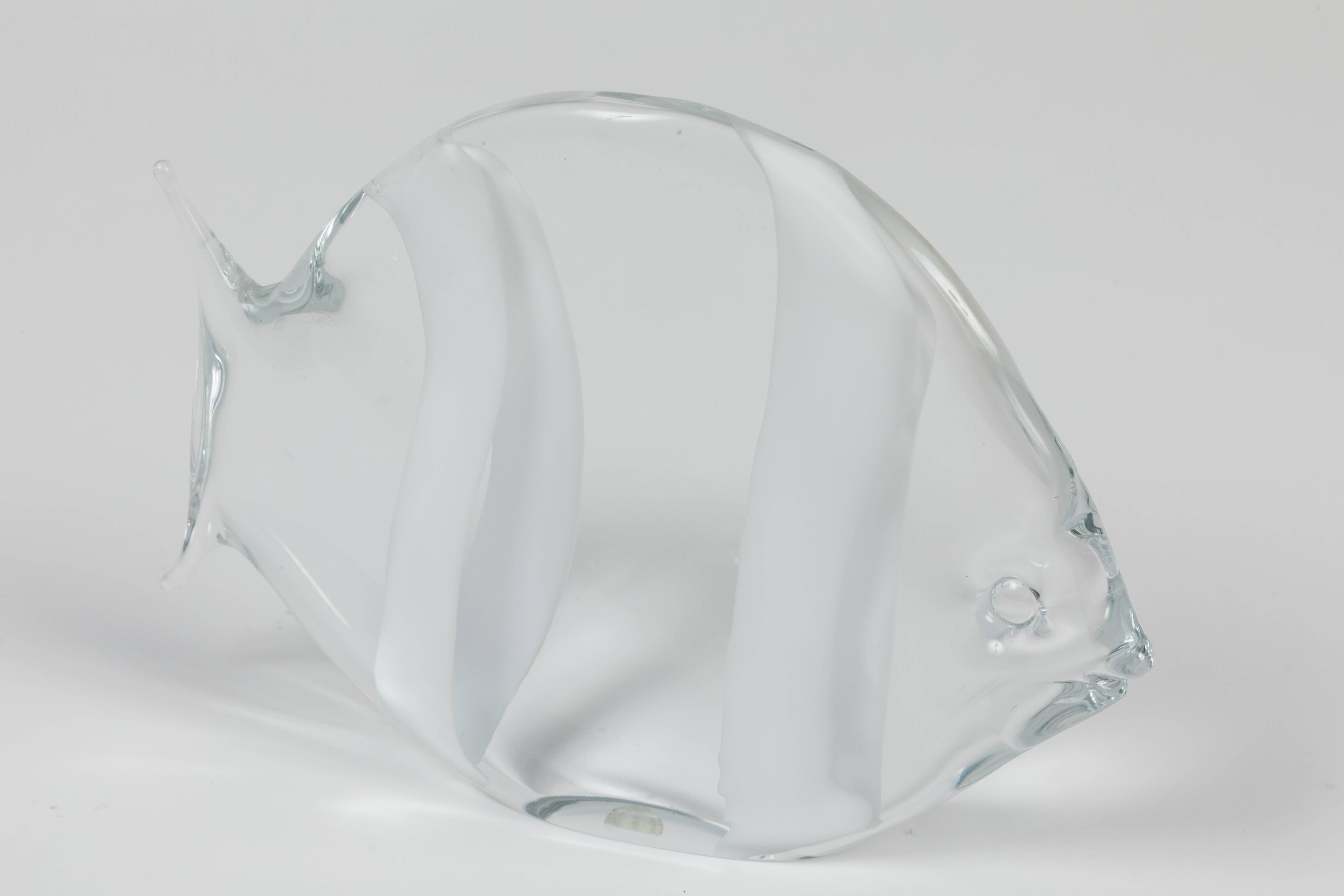 A charming vintage fish-shaped Murano glass sculpture by Archimede Seguso in clear glass with two white stripes. Signed with an acetate label.

About the artist: Archimede Seguso was an Italian glass manufacturer known for his intricate glass vases,