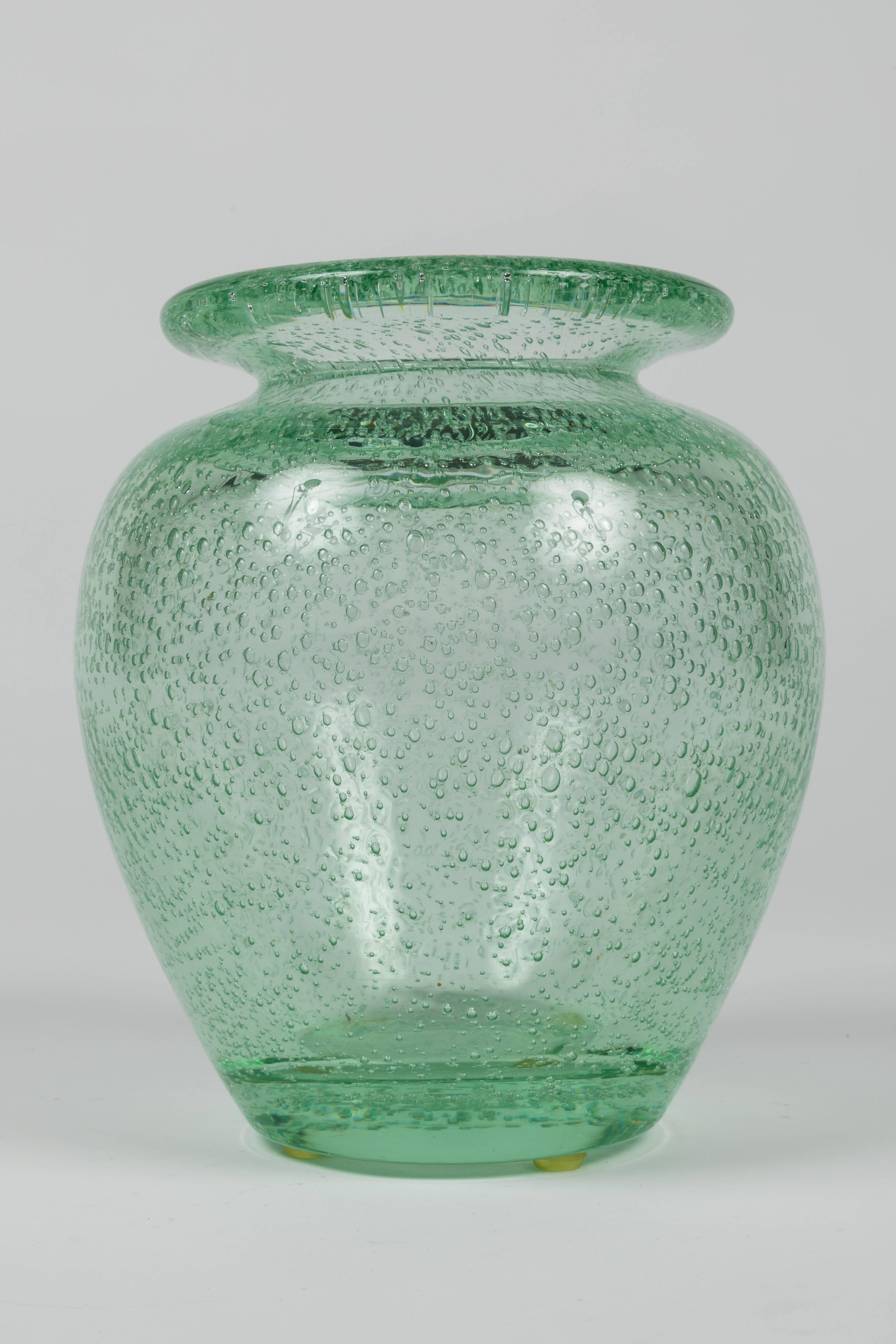 Wonderful shouldered vase with a thick turned lip in clear green glass with wonderful trapped air bubbles. Signed along the side bottom 