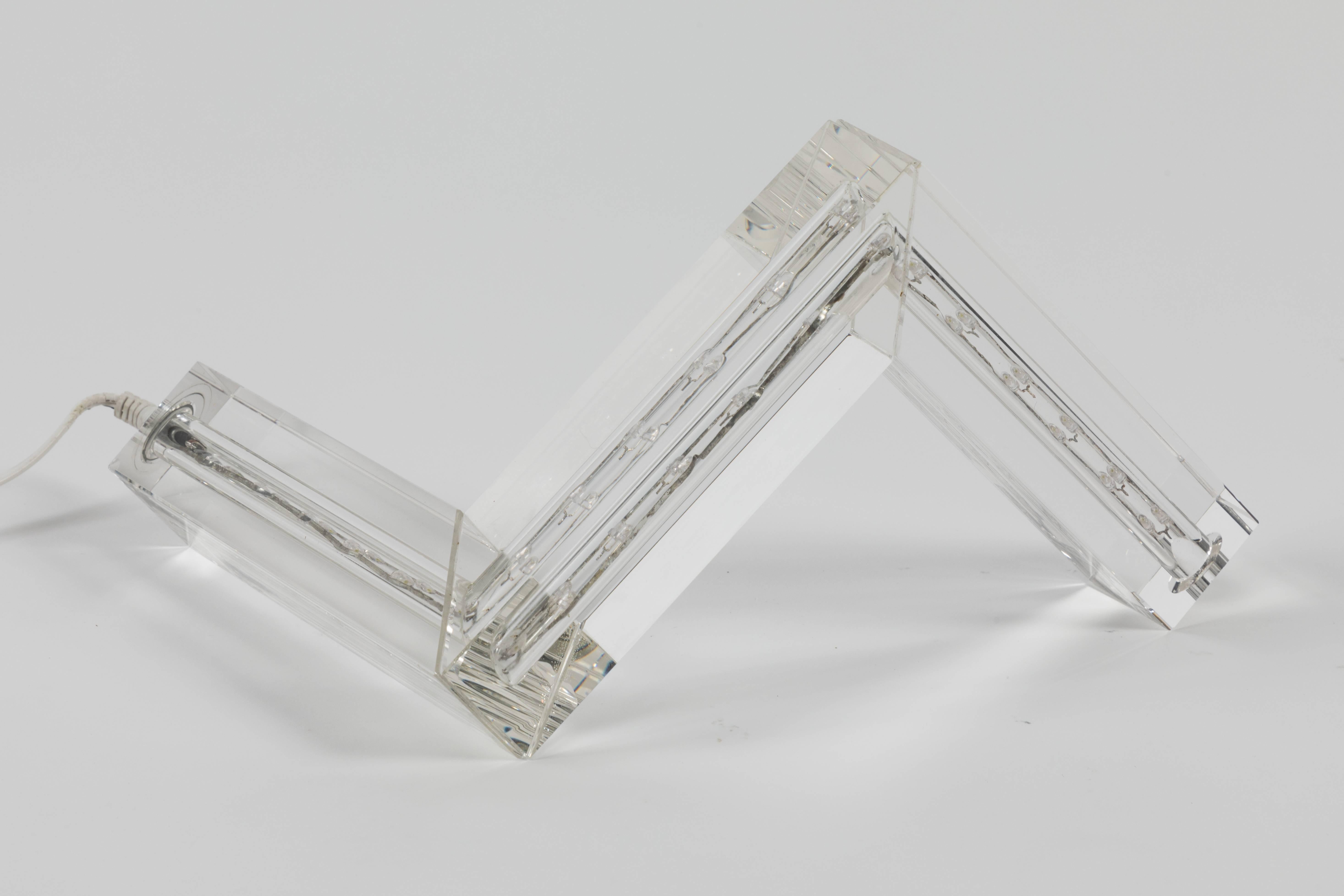 A vintage and elegant geometric zig zag crystal table lamp with a string of LED lights. This spiffy little accent lamp can be included in any style interior.