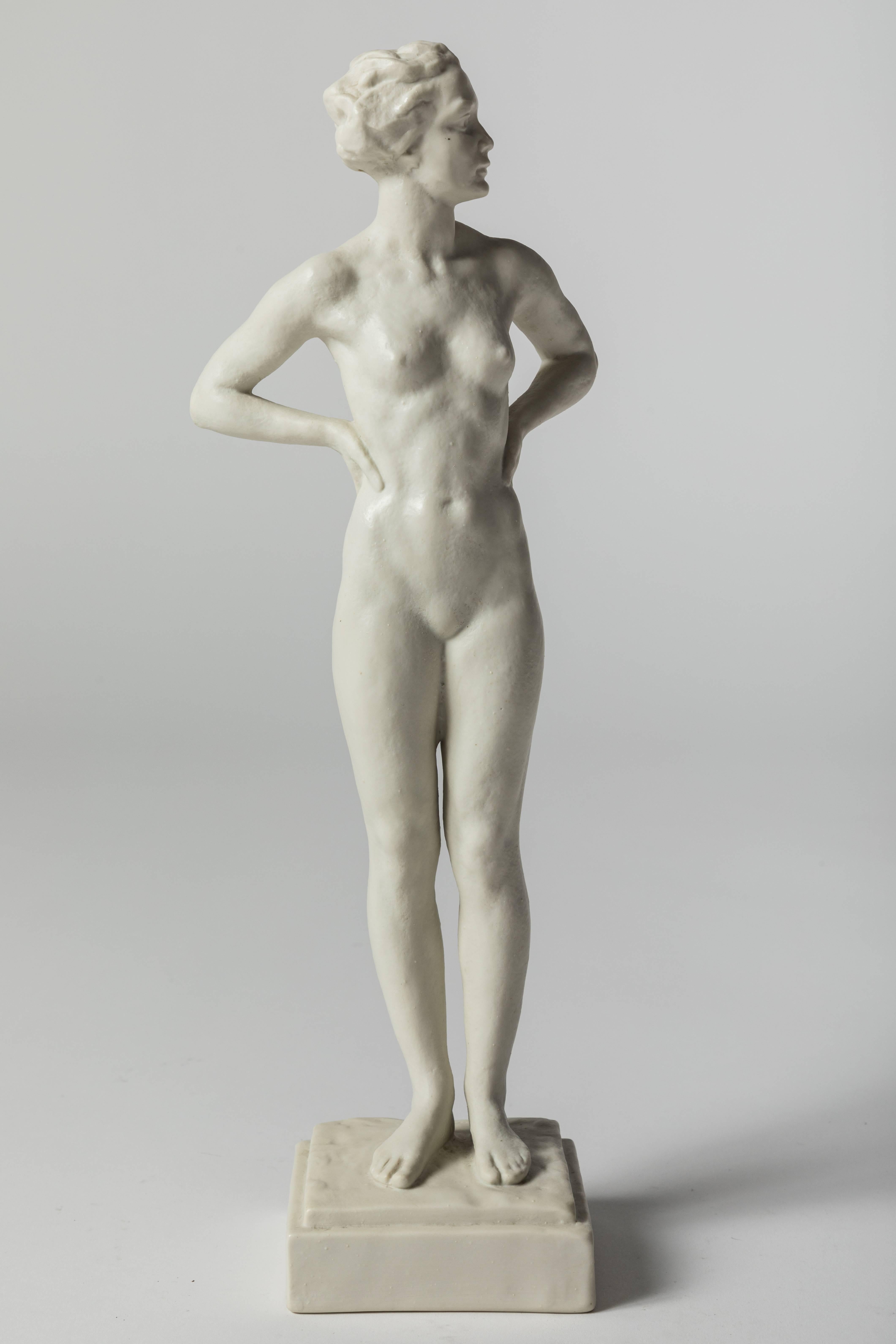 A superb porcelain statue of a standing nude female with arms resting on her back by Gustav Adolf Daumiller Schwimmerin. Figure has a wonderful wax like finish.

Stamped 