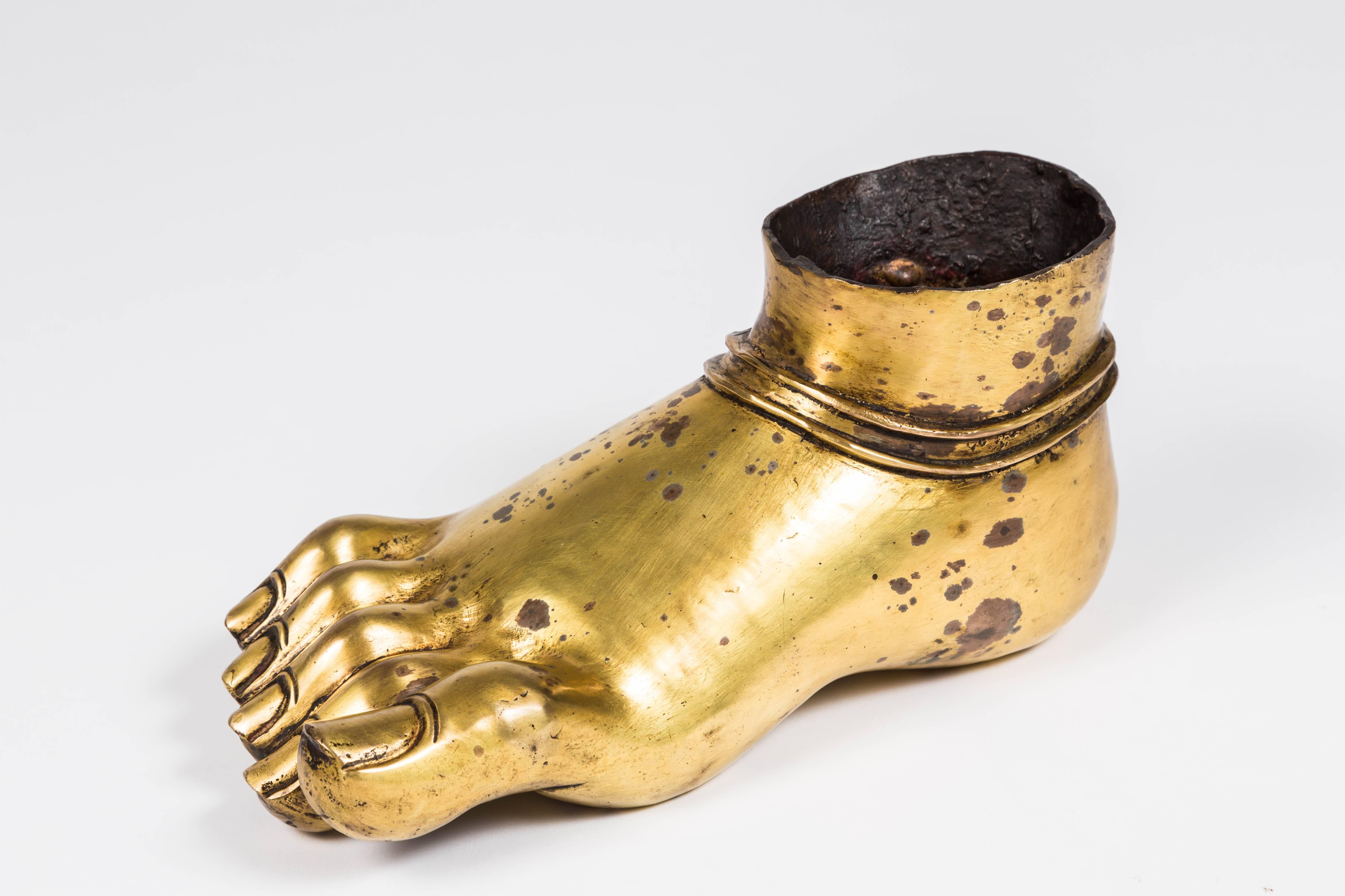 Wonderful gilt finished cast bronze Buddha's foot. This is meant to be a fragment but I believe rather that it was made to appear as such. A wonderful decorative item. Would look great sporting flowers or succulents.
