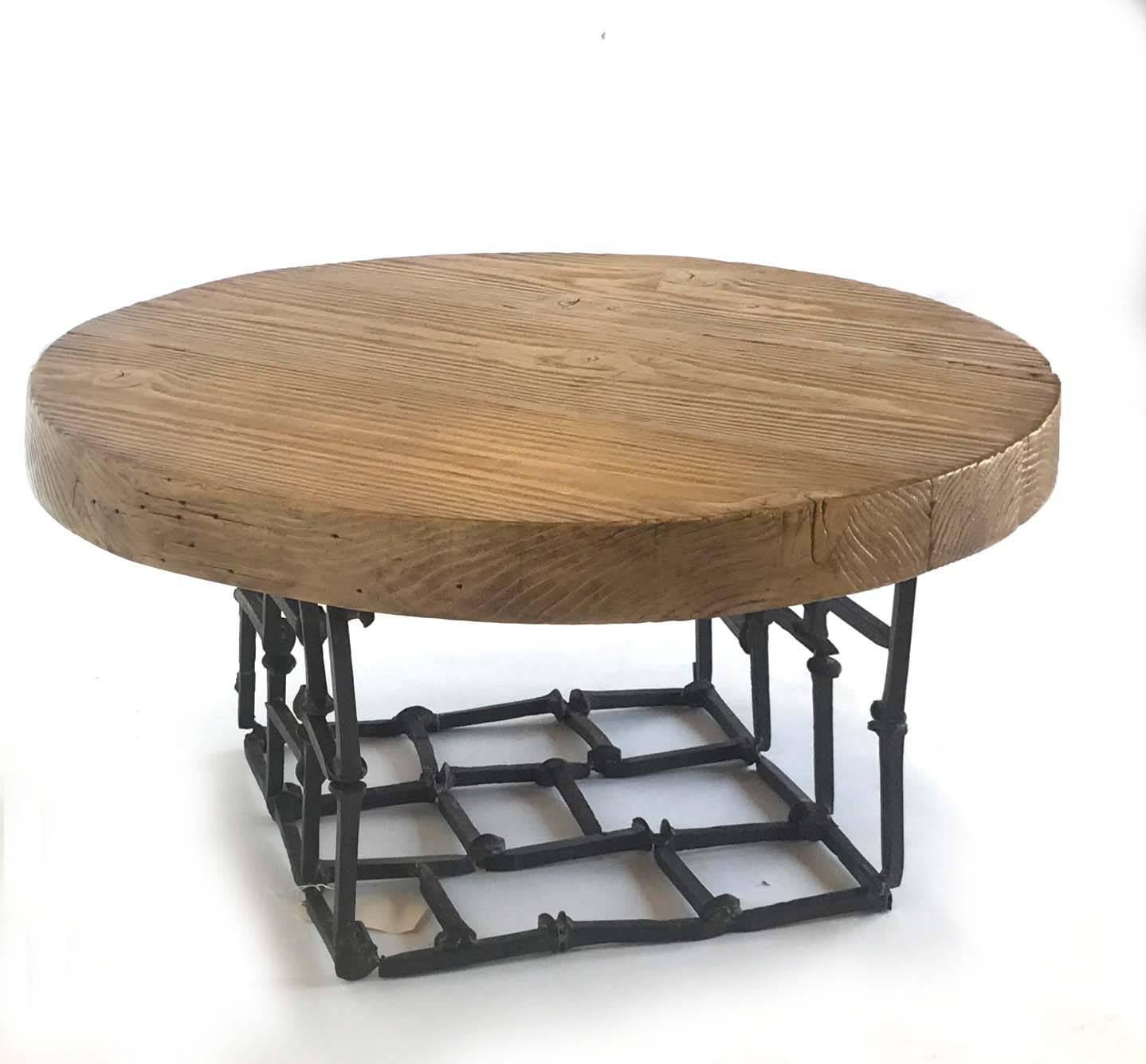 Modern Primitive low table made of vintage elements. 100 year old wood beam top in natural finish with naturally occurring distress. Smooth to the touch, beautiful patina.
Base is made of vintage railroad spikes. Made by Dos Gallos Studio in Los