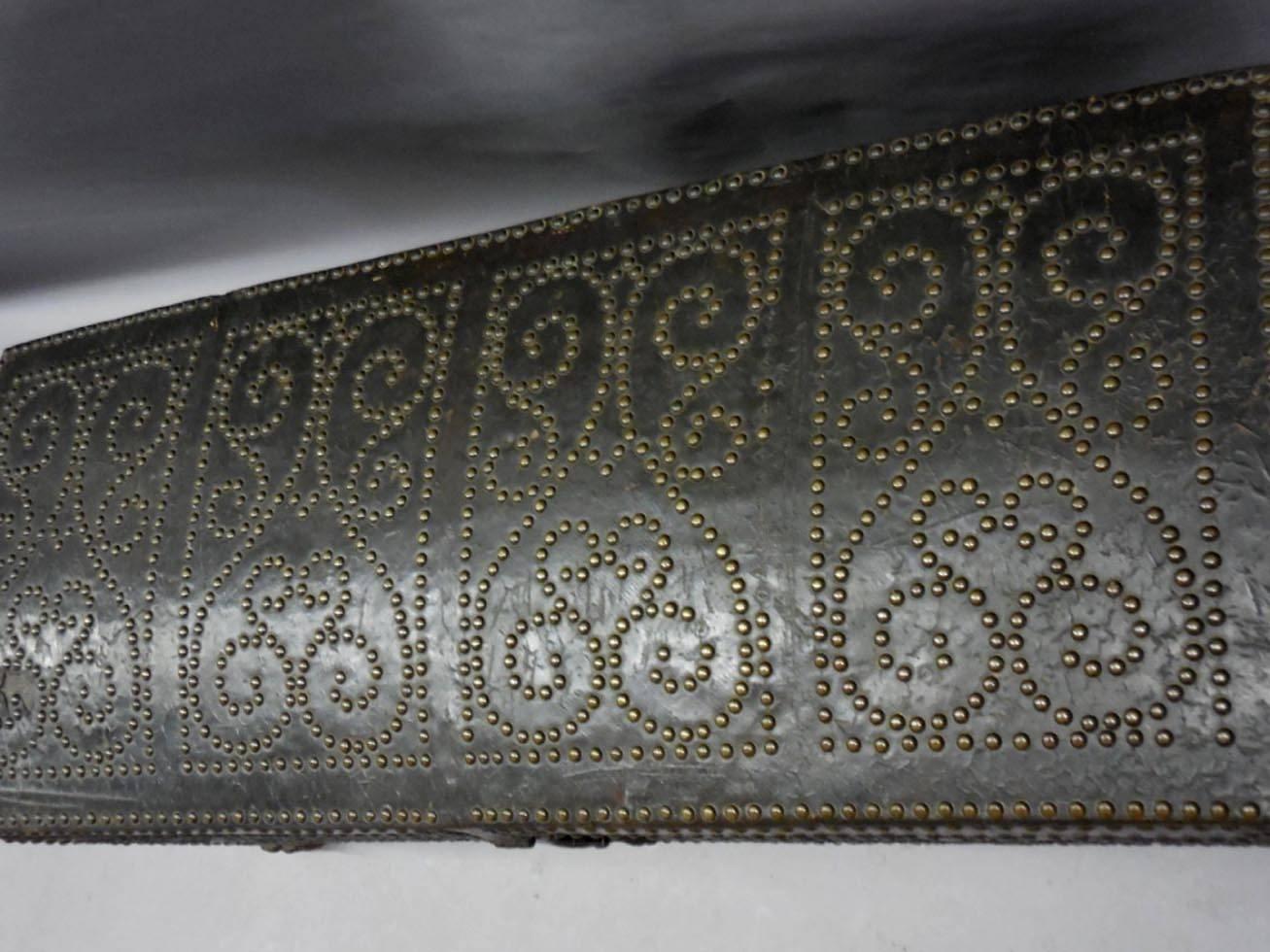 Domed leather coffer with brass studs, patterned in four quadrangles. Carved feet. All original hardware and in good condition considering its age. Some areas of leather are deteriorated but not interfering with form or function, 18th century