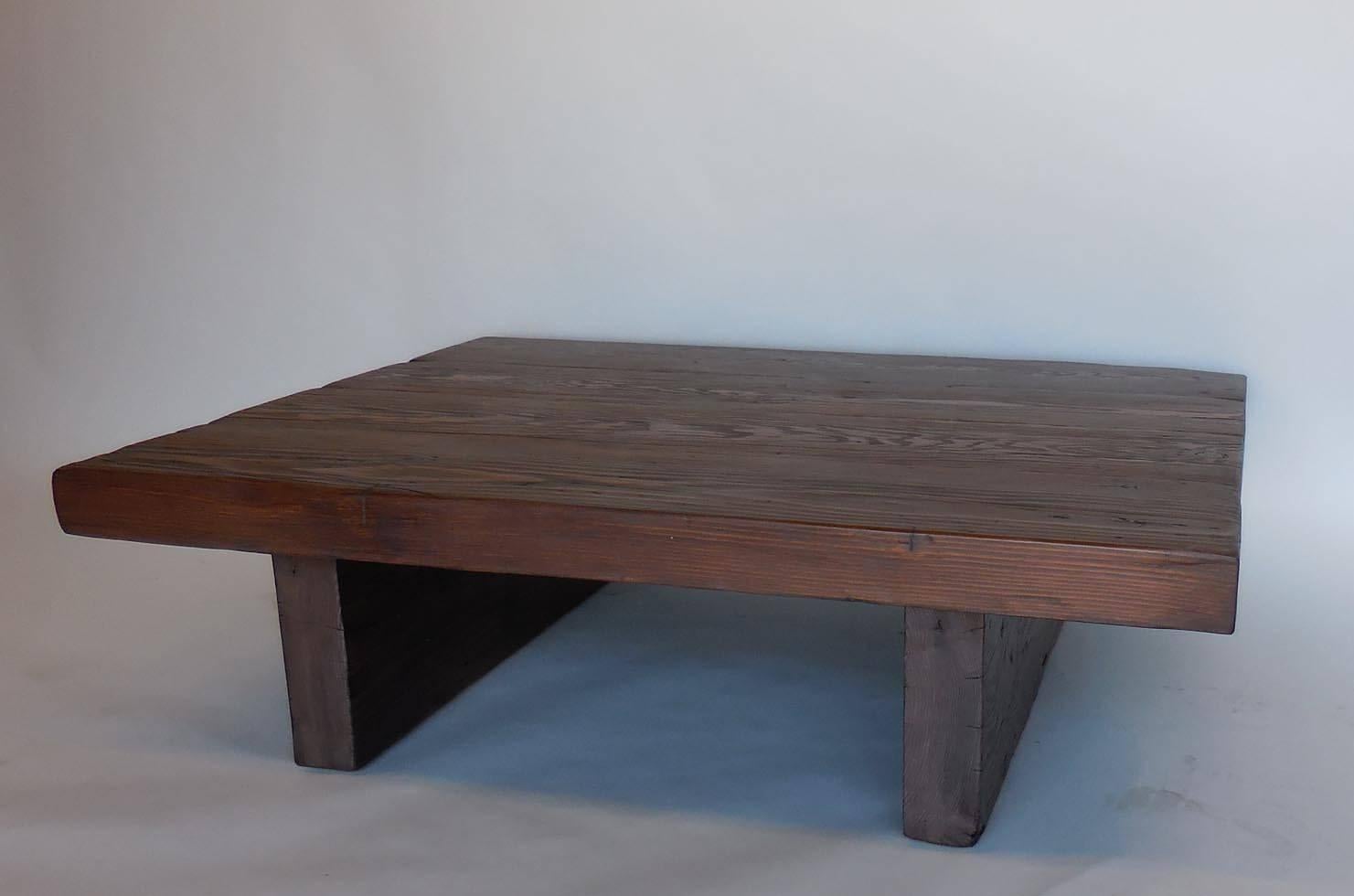 Reclaimed 100 year old beam coffee table. Slabs are 3.5 inches thick. Great old warm natural patina. Naturally worn wood. Can be made in custom sizes. Made in Los Angeles by Dos Gallos Studio. This existing piece is on sale. Please inquire for