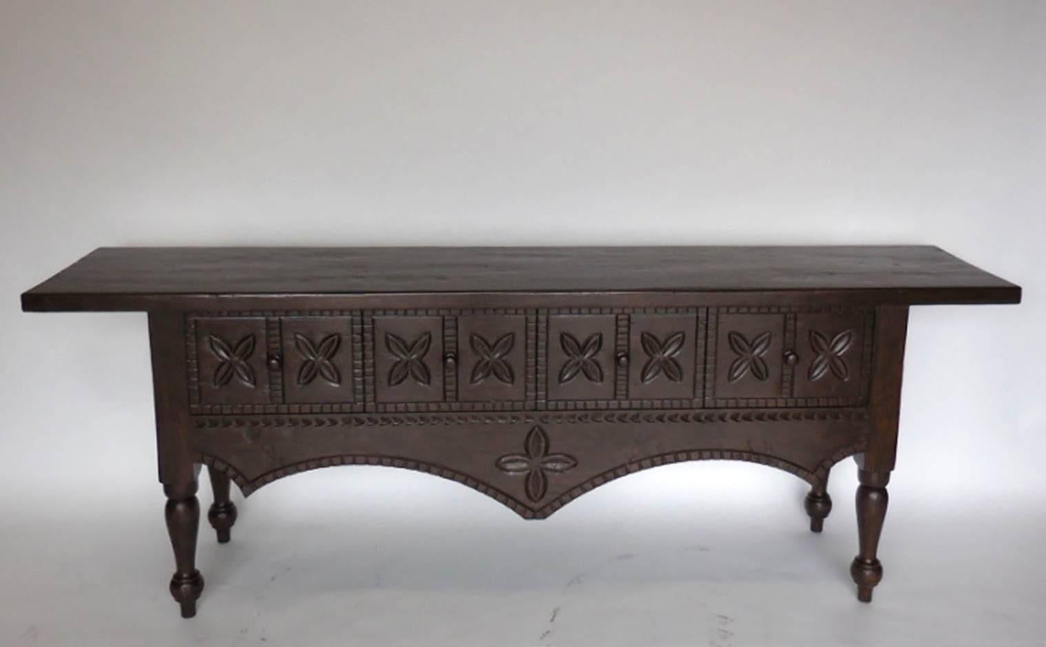 Beautifully carved walnut console with four drawers based on an indigenous Guatemalan design. Can be made in custom sizes and finishes. Made in Los Angeles by Dos Gallos Studio.
CUSTOM PRICES ARE SUBJECT TO CHANGE. PLEASE INQUIRE BEFORE PLACING AN