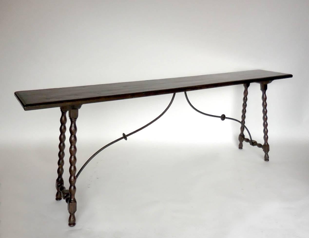 Custom walnut bobbin console with iron supports. Thin, gracious profile. Can be made in custom sizes and finishes. Can be made in any size and finish, in oak, mahogany or walnut. Made in Los Angeles by Dos Gallos Studio.  
PRICES ARE SUBJECT TO