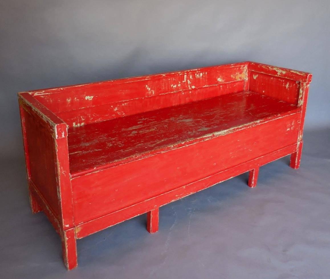 Late 19th-early 20th century painted Swedish kokssoffa (kitchen sofa) used as a bench in a farm kitchen as well as a pull-out bed for the house maid. Seat lifts up for storage and front pulls out for using as a bed. Layers of old paint. Great old