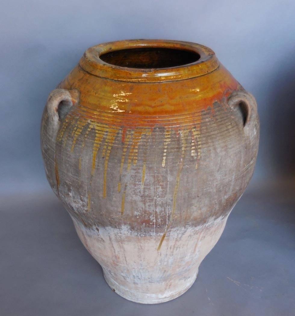 Two Spanish clay glazed pots. Originally used to transport honey. In excellent condition and beautiful exteriors. Three handles, all original. SOLD AND PRICED INDIVIDUALLY.
