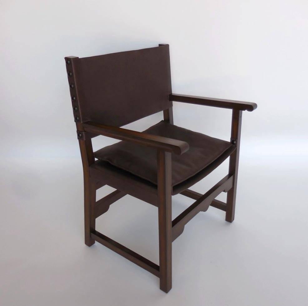 Leather sling back and seat with a low profile seat cushion. Walnut frame with rubbed oil finish. Leather is com. Can be in custom sizes. As shown 26” W x 22” D x 36” H seat: circa 18 H. Arm height at 27 inches.
Price does not include leather.
Made
