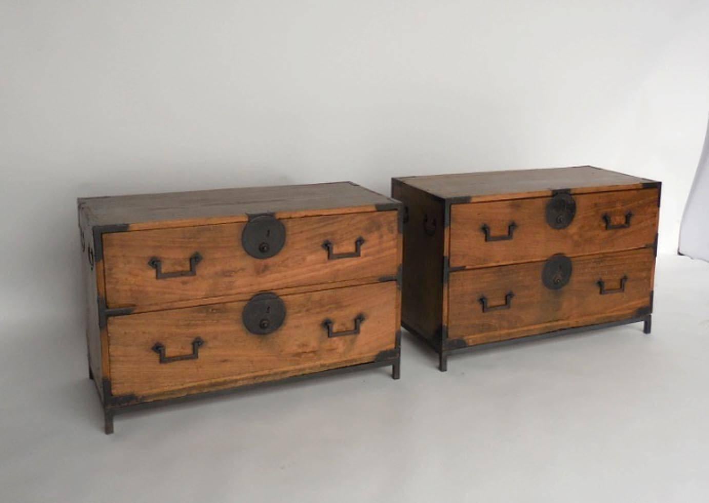 19th century Hinoki wood tansus on custom iron bases. All original. Hand-forged hardware, bamboo nail. Fully functional, two drawers each. Natural beautiful patina.