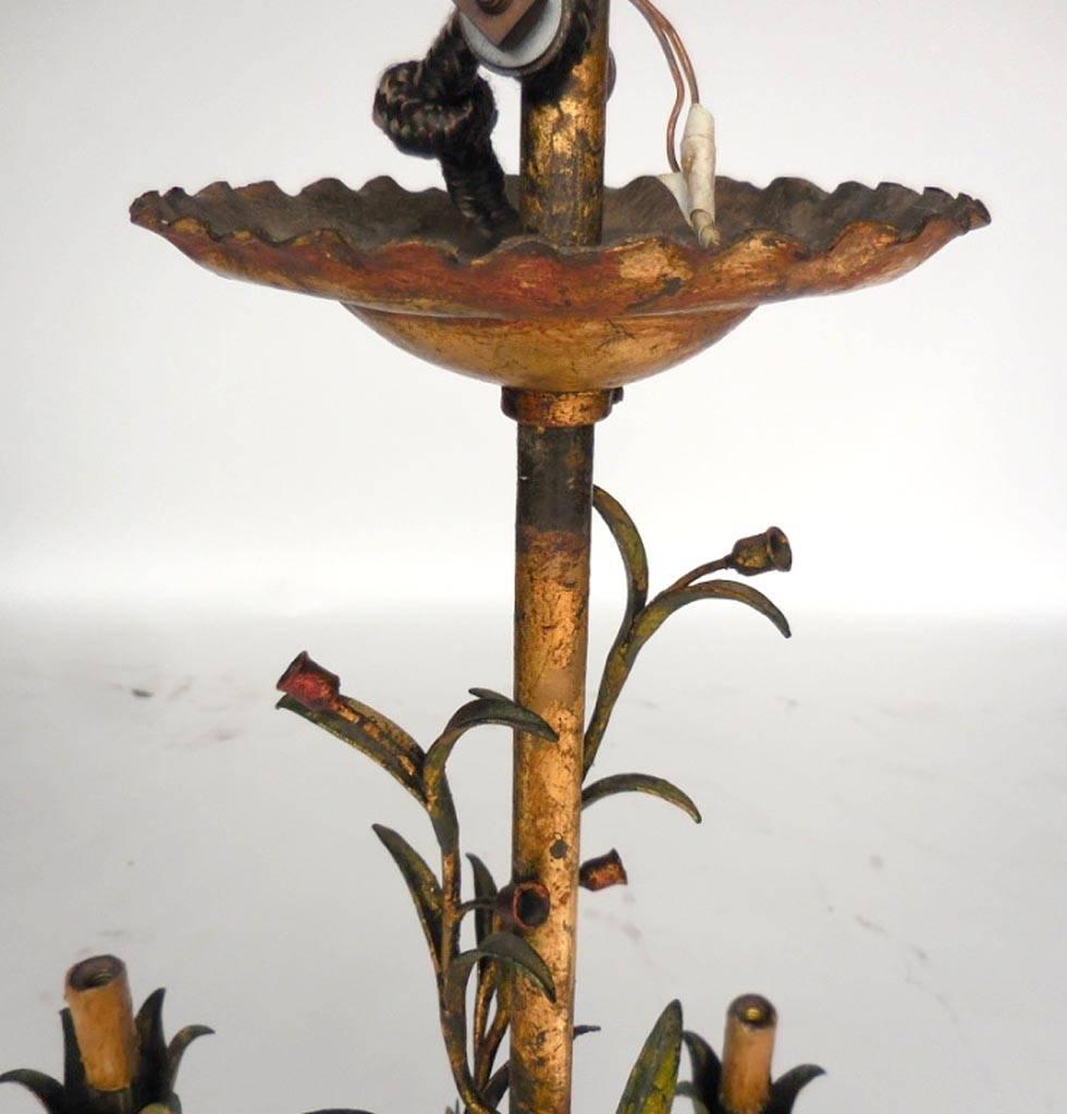 Mid-20th century gilded and painted chandelier with tiger lilies, cattails and daisies. Delicate. Original wax candles. Pair of matching sconces available. Sold as is (needs to be rewired).