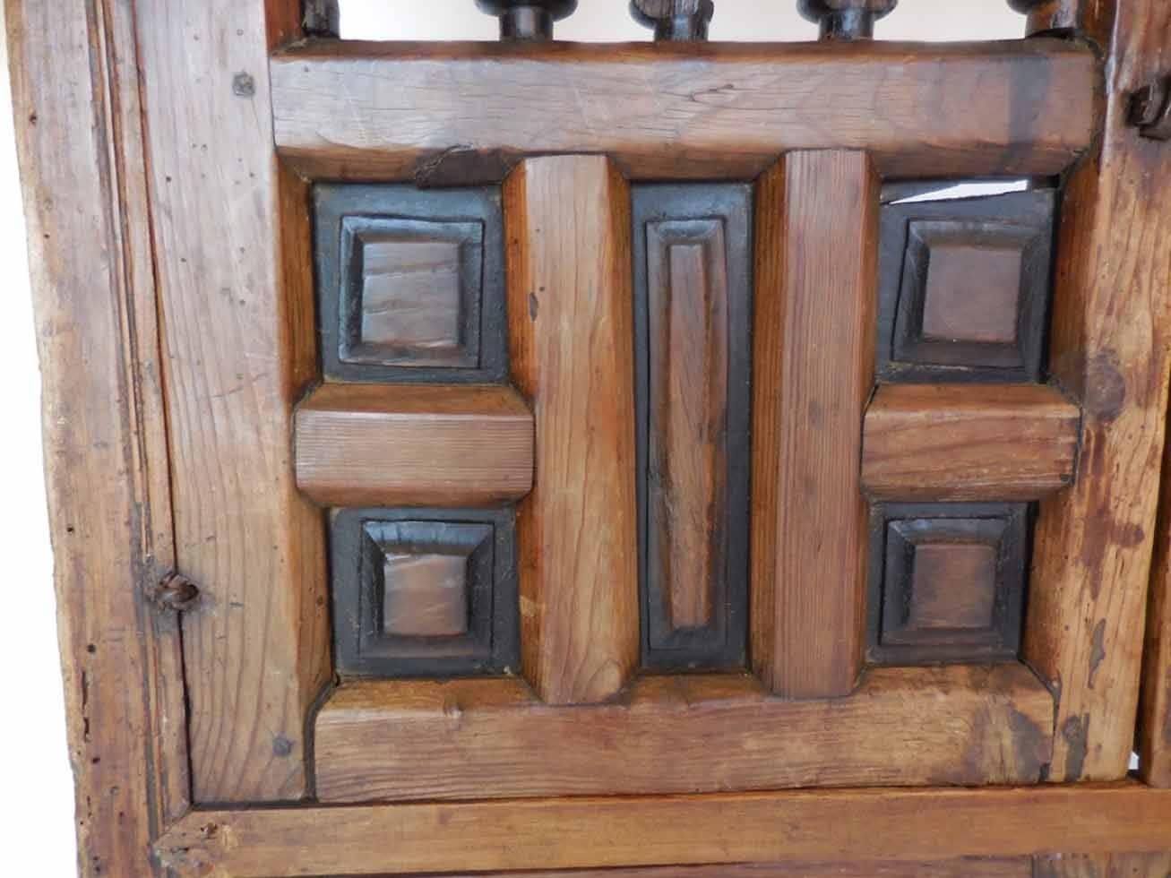 18th century Spanish shutters. Top and bottom set of shutters in a window frame. All original hardware. Wear consistent with age and use, but functions well. Classic Spanish style. Some losses on turnings and frame, but none of which distracts.