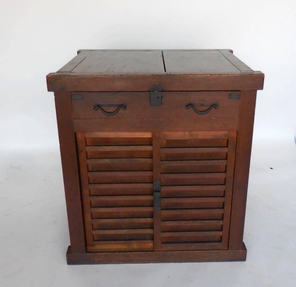 Edo period, unusual Japanese chest. Sides pop out on two sides to reveal interior drawers and compartments. Front doors are sliding doors with shelf space and drawer behind. One large drawer in front. All original hardware. Bamboo nails and mortise
