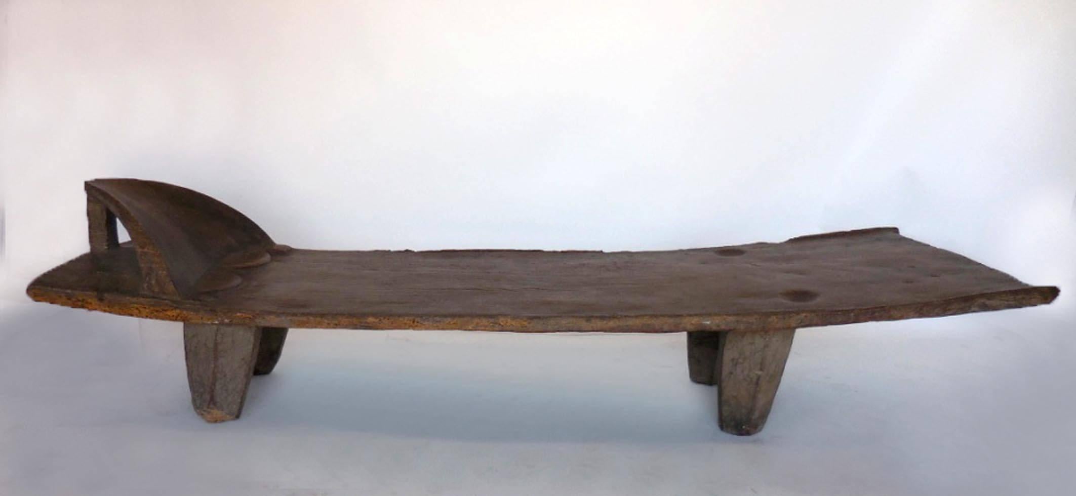 African antique daybed from the Sinufo tribe in Mali. Top is carved from one piece of wood. Hand hewn, beautiful patina. Primitive modern piece.
Measures: 101.5 long x 27-31.5 wide 24.5 high. Seat is about 14.5 – 17″ H.