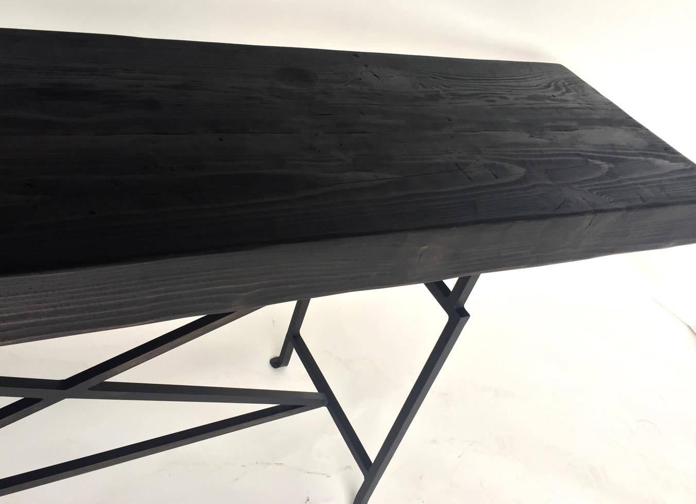 Custom douglas fir beam console with custom hand-forged iron base. Can be made custom in different style base and in a variety of finishes. Shown here in an open grain ebony finish. Made in Los Angeles by Dos Gallos Studio.
PRICES ARE SUBJECT TO