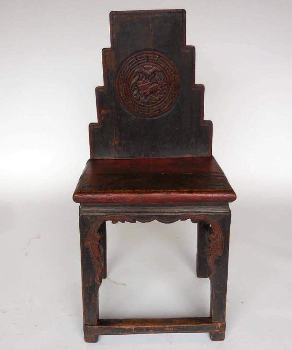 Early 19th century, all original Chinese chair with original red paint, and dragon and leaf carvings. Nice worn patina throughout.
  