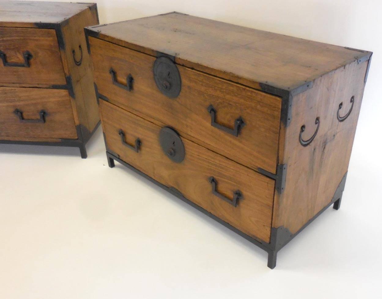 Pair of 19th century Kiri wood, tansus on custom iron bases. Original hardware and bamboo nails. Two drawers each. Handsome patina.