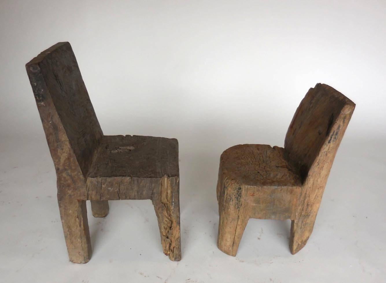 Primitive chairs carved from a tree trunk. Dense tropical wood. Hand hewn Primitive, modern shapes.
Left measures 13.5 x 17 x 31.5 H seat 15.5 $975 
right 14 x 15 x 25 H seat 14.5 H $515.
Can be sold individually.