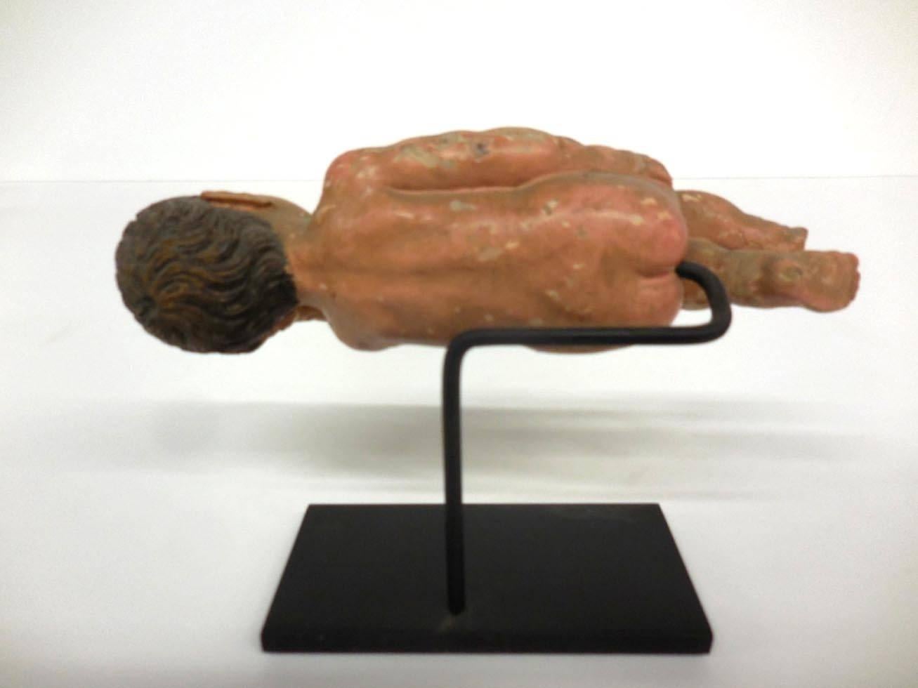 Pre 1825, Spanish Colonial sleeping nino santo on custom base. Original condition. Polychrome on cedro wood. Intricately carved and painted features and wavy hair. All fingers are intact but one foot is missing a piece.
Was part of a nativity