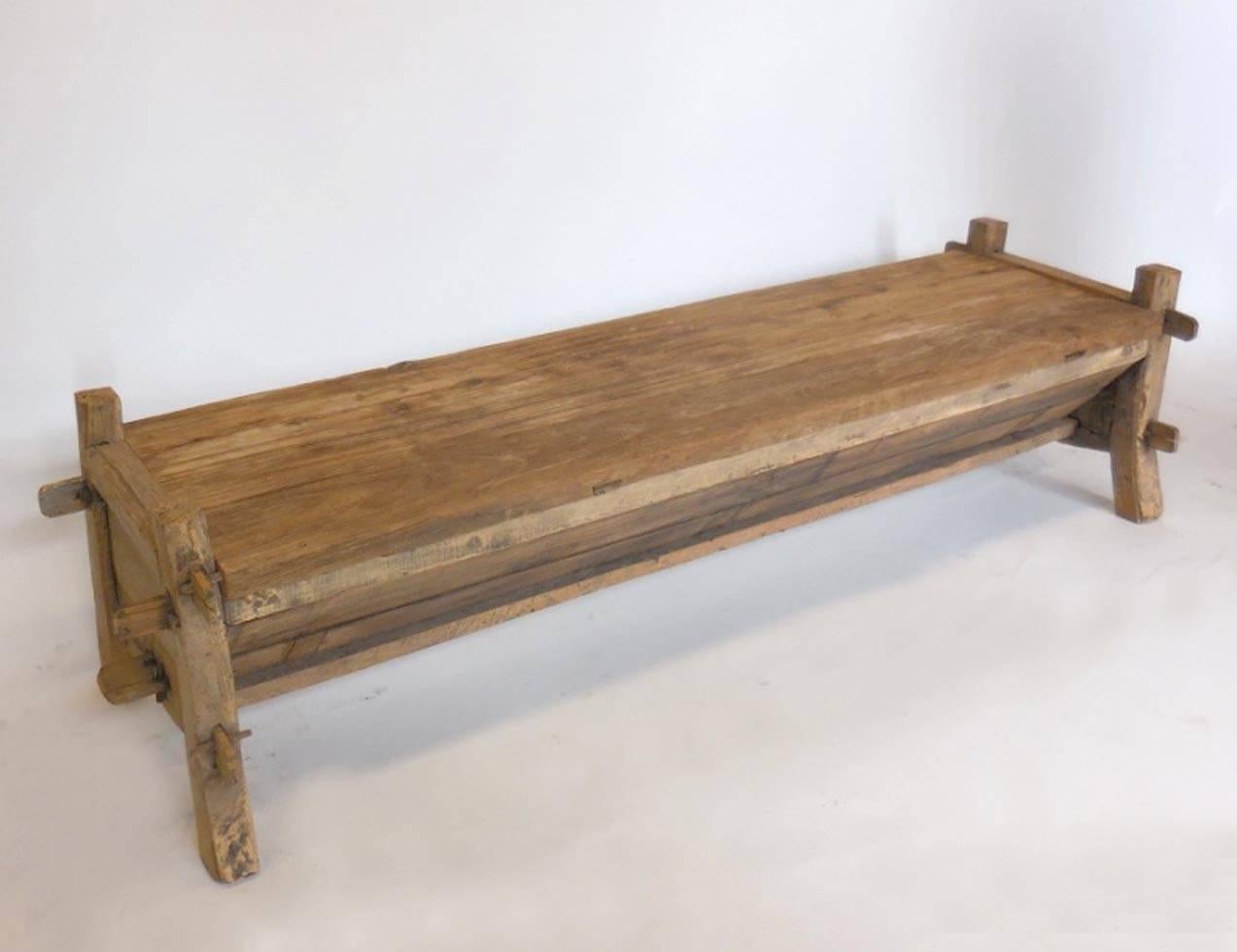 Great storage piece! This is a wooden trough and lid with a newer hinge for easy open and close. The wood is all naturally aged and has a nice rustic patina, but smooth to the touch. Fully functional as a coffee table or bench, with storage. Mortise