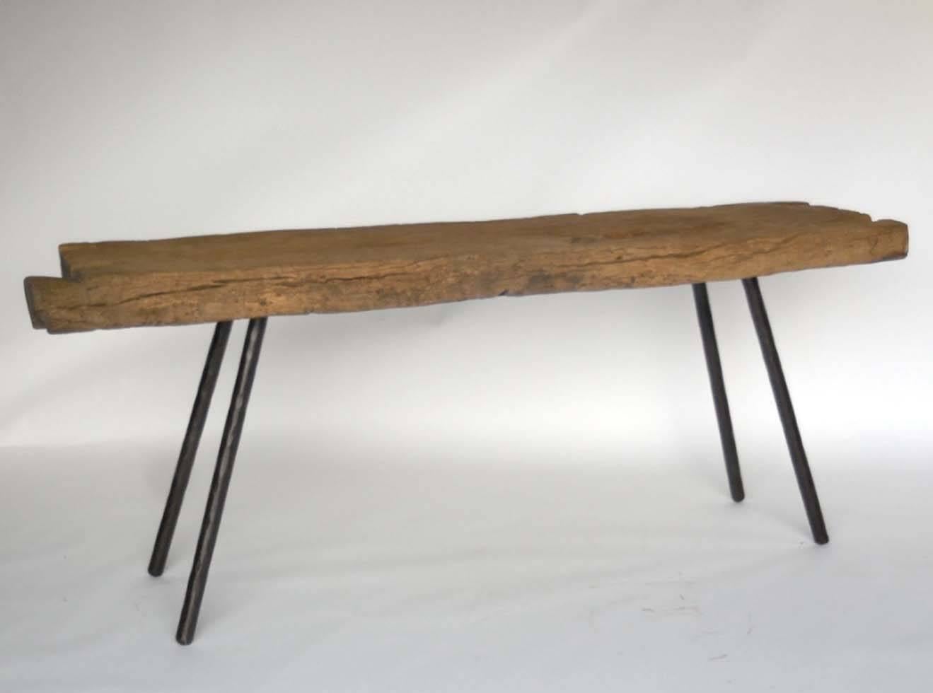 200 year old Japanese wooden trough atop contemporary hand-forged iron legs. Measures: Trough is about 3 1/2" -  4" thick, beautiful, old worn wood with naturally weathered patina. Smooth to the touch. One of a kind piece made by Dos