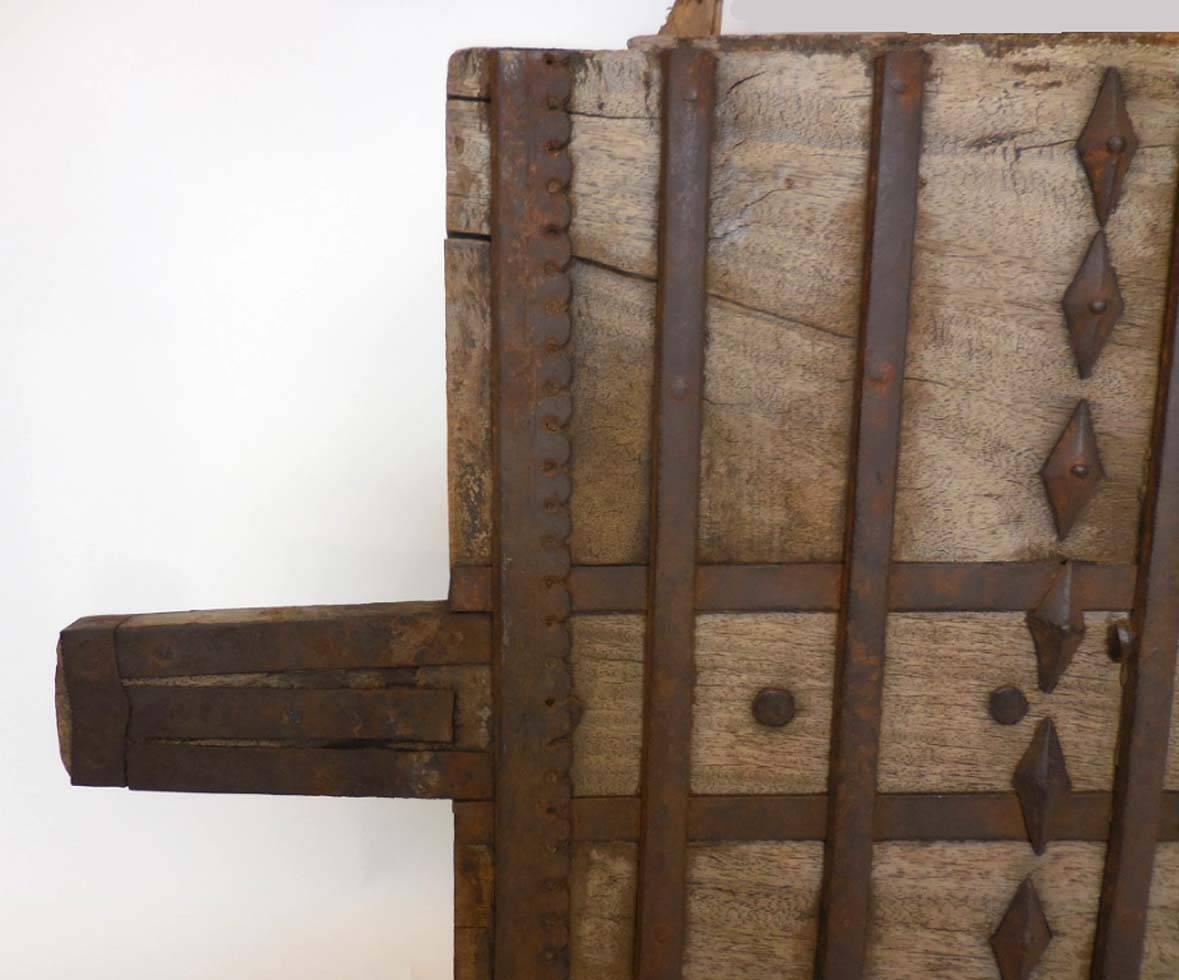 Old wood with decorative iron. Can be hung on wall either vertically or horizontally. Interesting iron work and pattern. Handles can be removed Width including handles is 52.