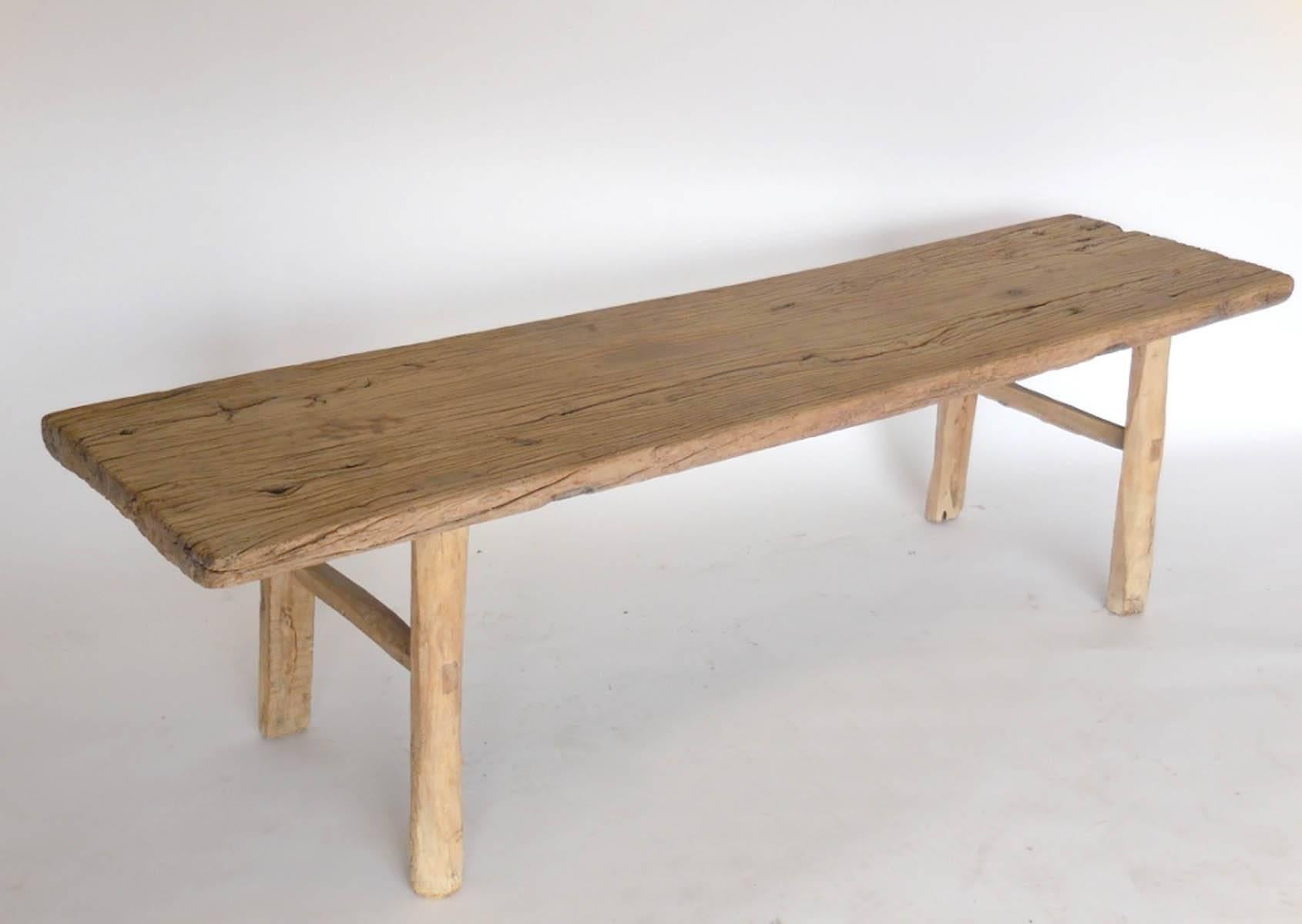 19th century one plank elmwood backless bench with two short stretchers. Lovely wood with smooth patina.