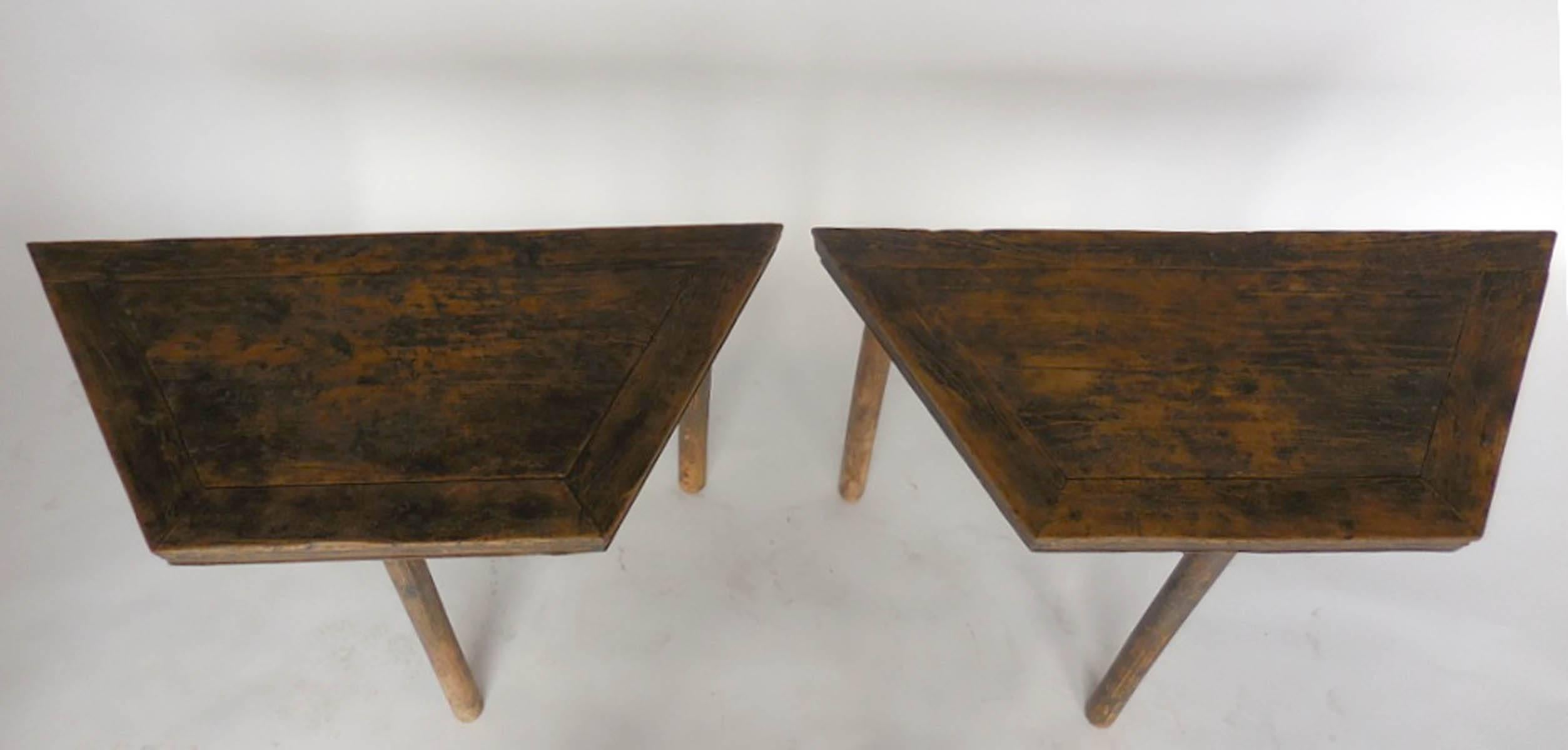 An interesting pair of framed top demilunes! They can form, a par of four-sided demilune tables, an hexagonal table when put together, a console when placed side of side or a corner piece when placed together at an angle. 
Beautiful elmwood with