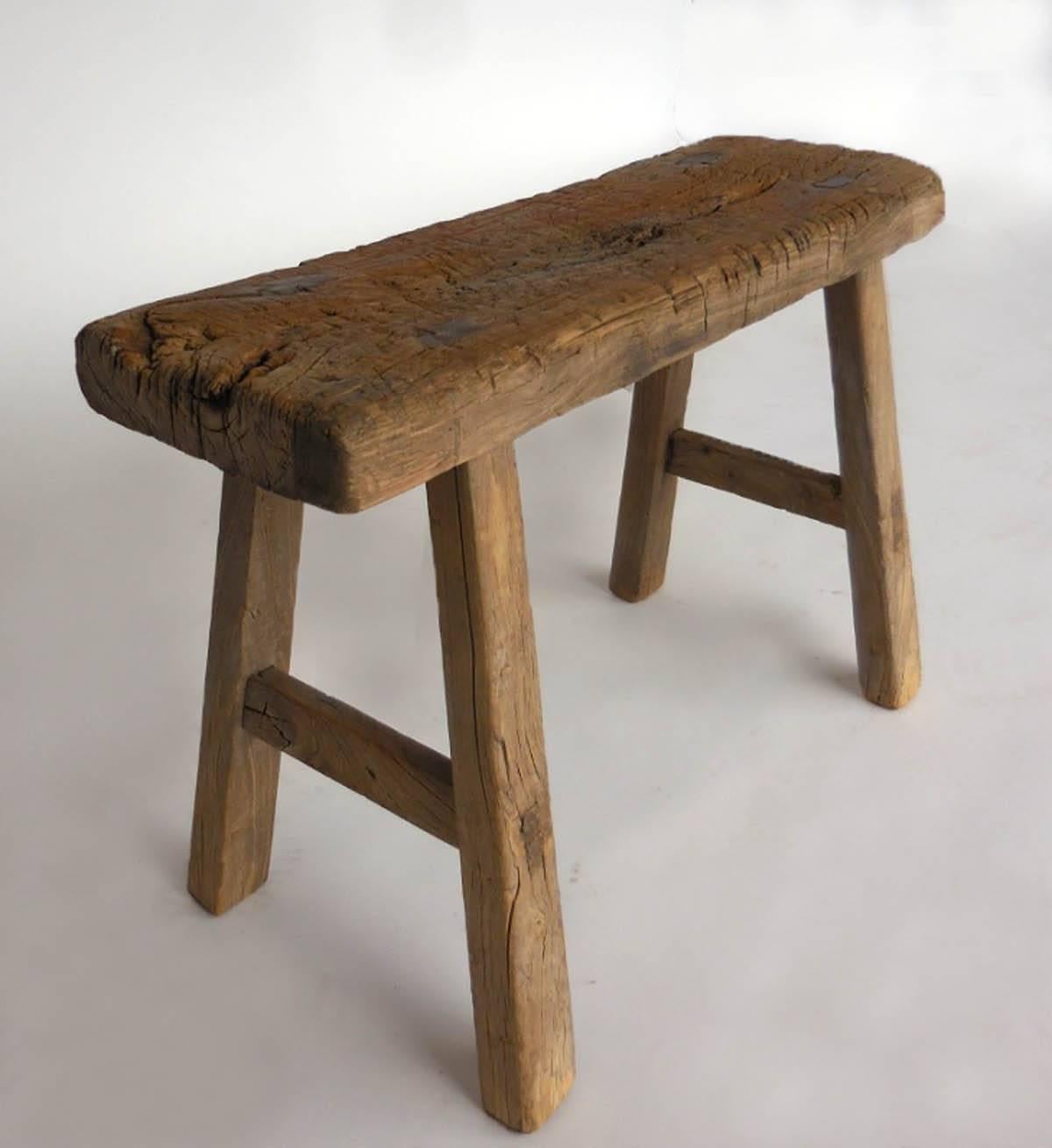 Sweet small bench made of elm showing lots of signs of use and wear but absolutely sturdy. Nice patina.