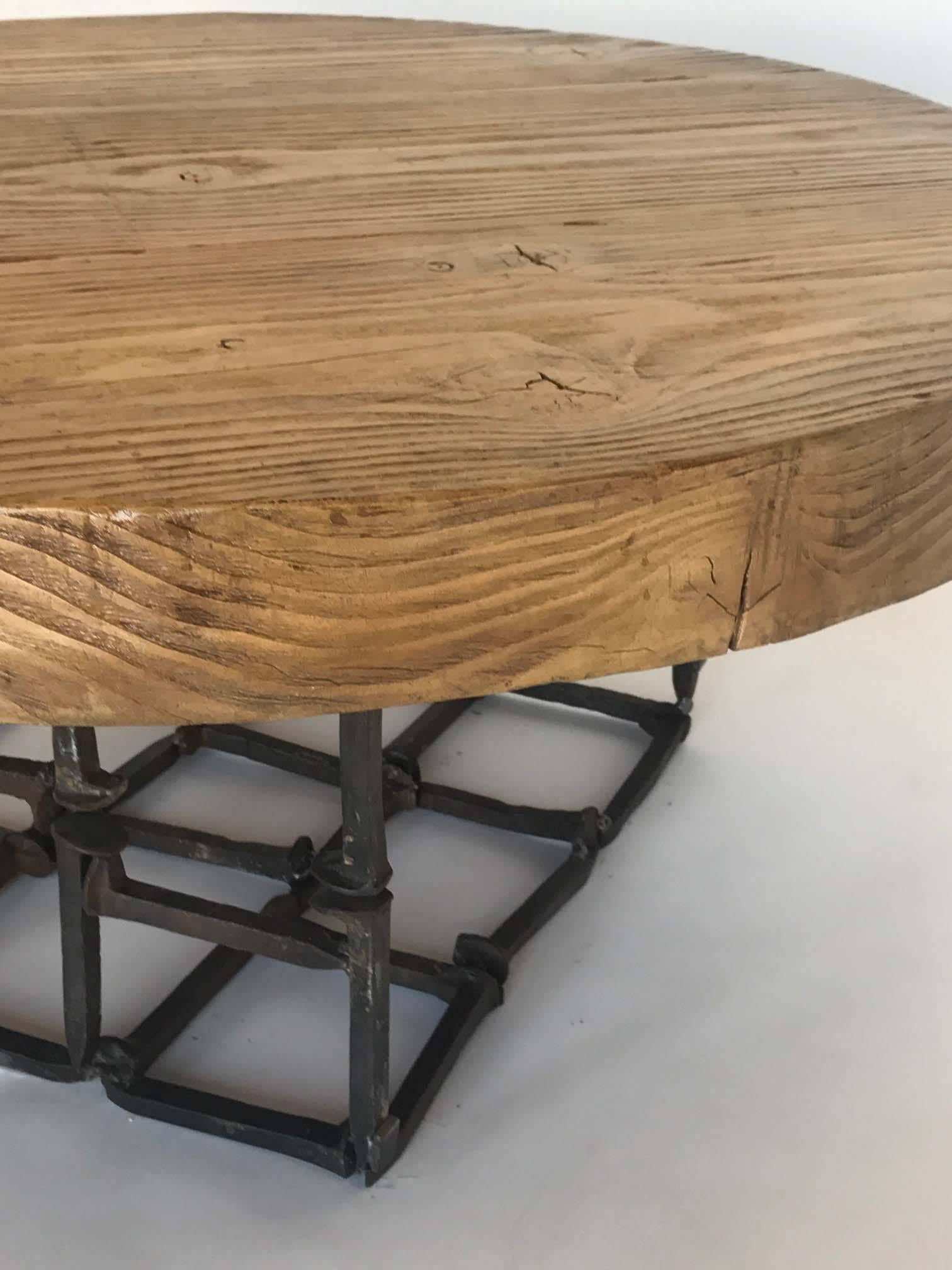American Dos Gallos Round Reclaimed Wood and Iron Spike Cocktail Table