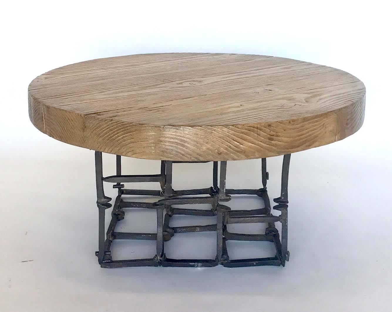 Contemporary Dos Gallos Round Reclaimed Wood and Iron Spike Cocktail Table