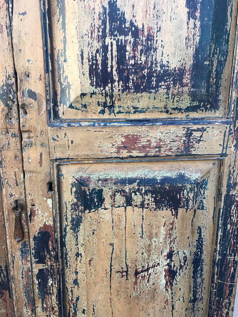 Pair of great looking doors with layers of old paint, mostly blue. 19th century, from the Guatemalan highlands.