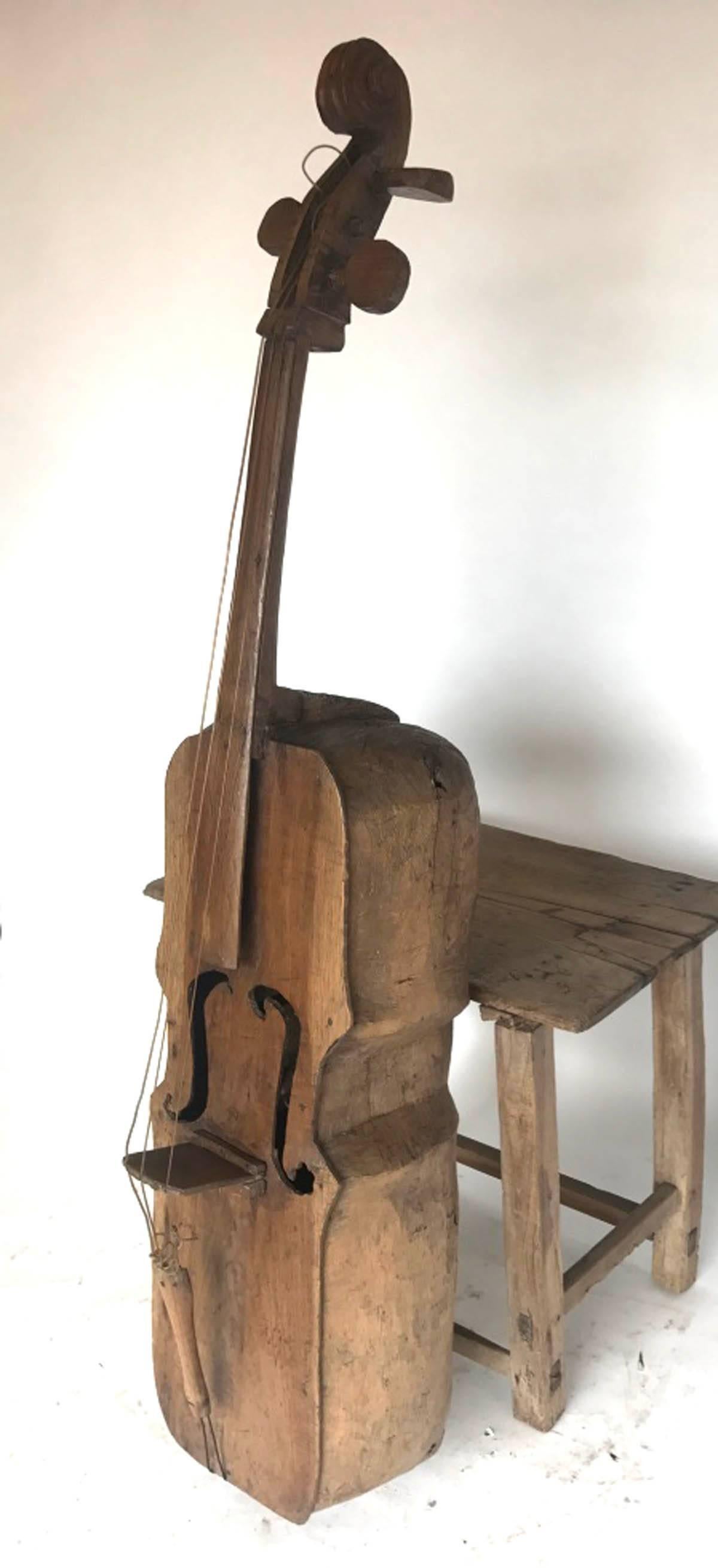 Wonderful piece of Folk Art! Back of body is carved out of one piece of wood. Old mariachi band bass, with a unique, sculptural shape. We have never seen one like this before!