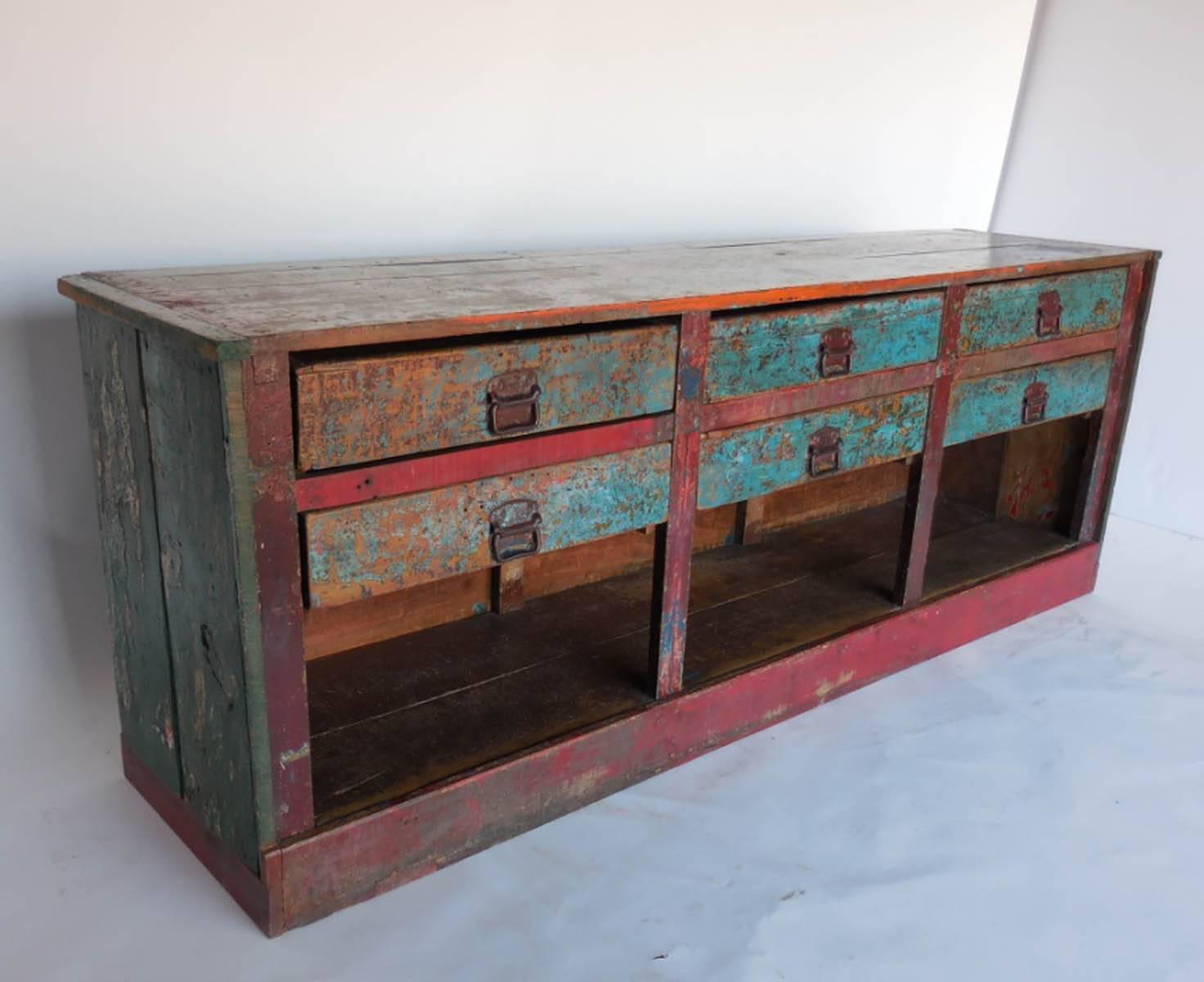 Early 20th century painted shop counter. Six drawers. Rustic, from the highlands of Guatemala. Layers of old original paints. Great patina. Original hardware.