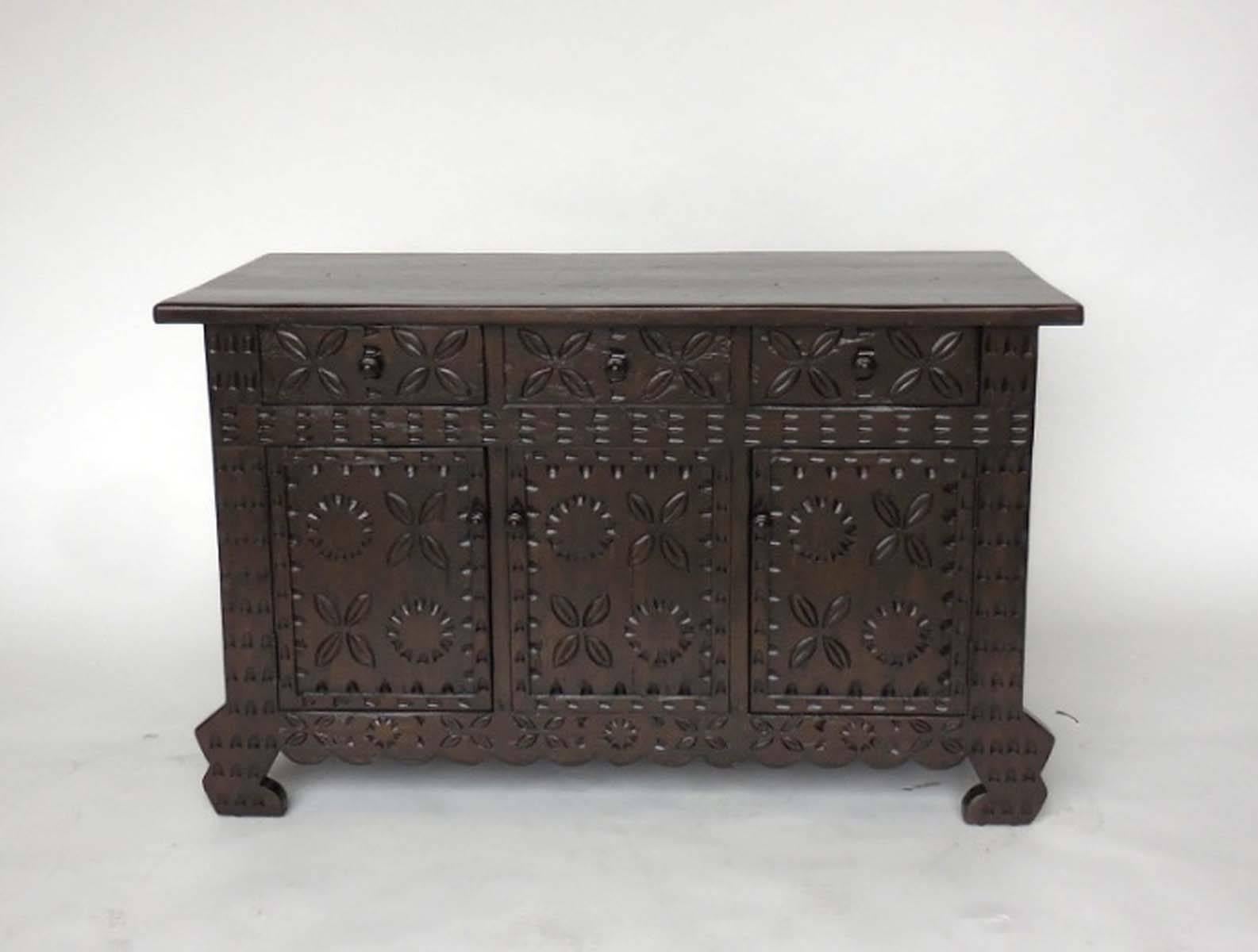 Custom carved cabinet shown here in walnut #3 with light distress. Can be made in any size and finish, in walnut. Carvings on three sides.
Handmade in Los Angeles by Dos Gallos Studio.
PRICES ARE SUBJECT TO CHANGE. PLEASE INQUIRE BEFORE PLACING AN
